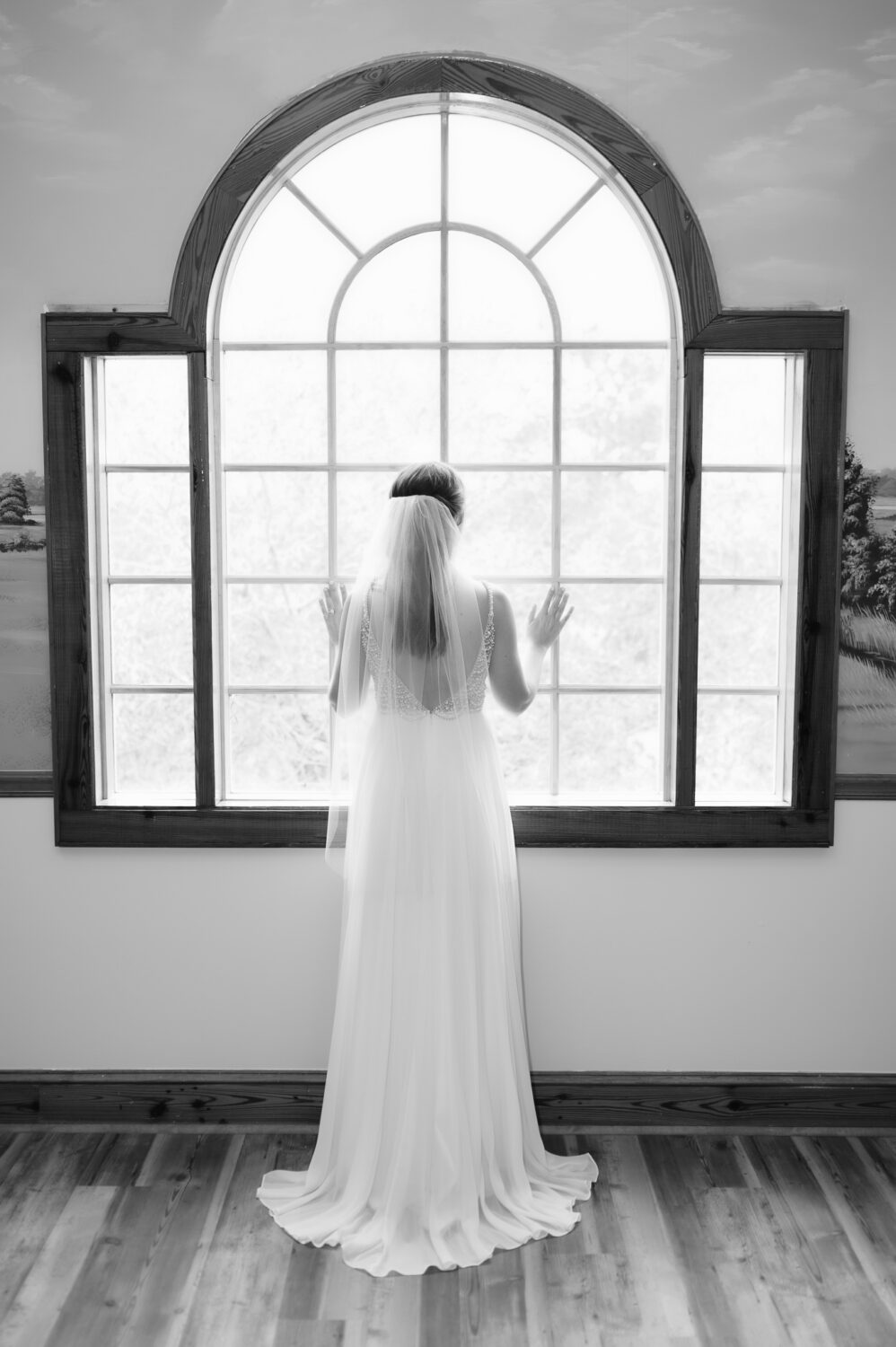 Bride looking out the window - Caledonia Golf & Fish Club