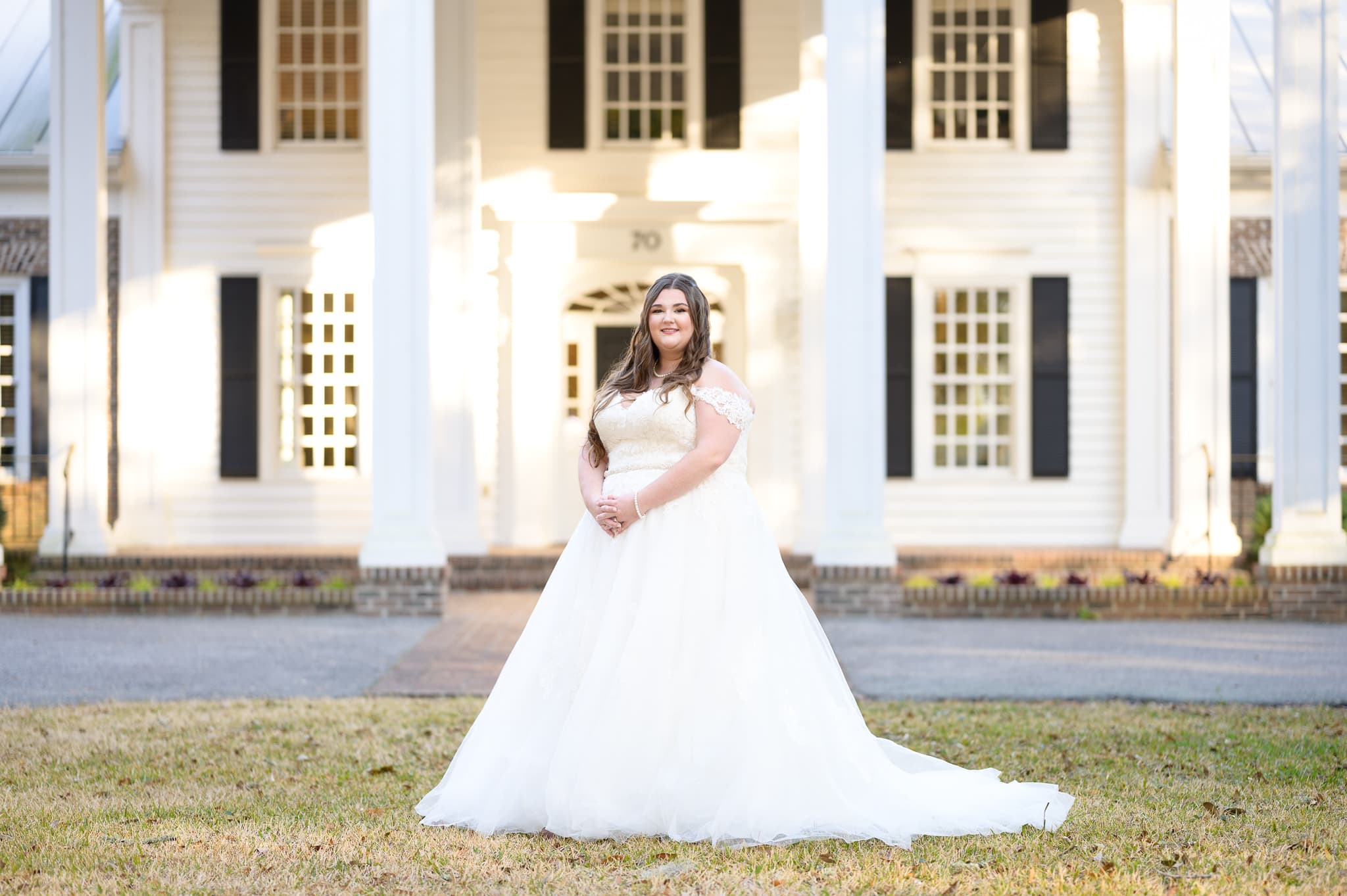 Bride standing in front of clubhouse - Pawleys Plantation Golf & Country Club
