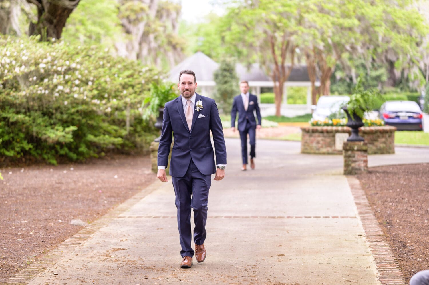 Groom walking to the ceremony - Caledonia Golf & Fish Club