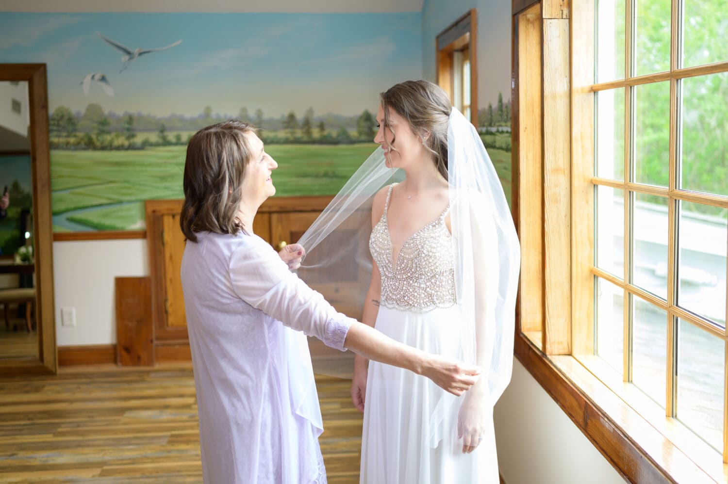 Mom helping bride with her veil - Caledonia Golf & Fish Club