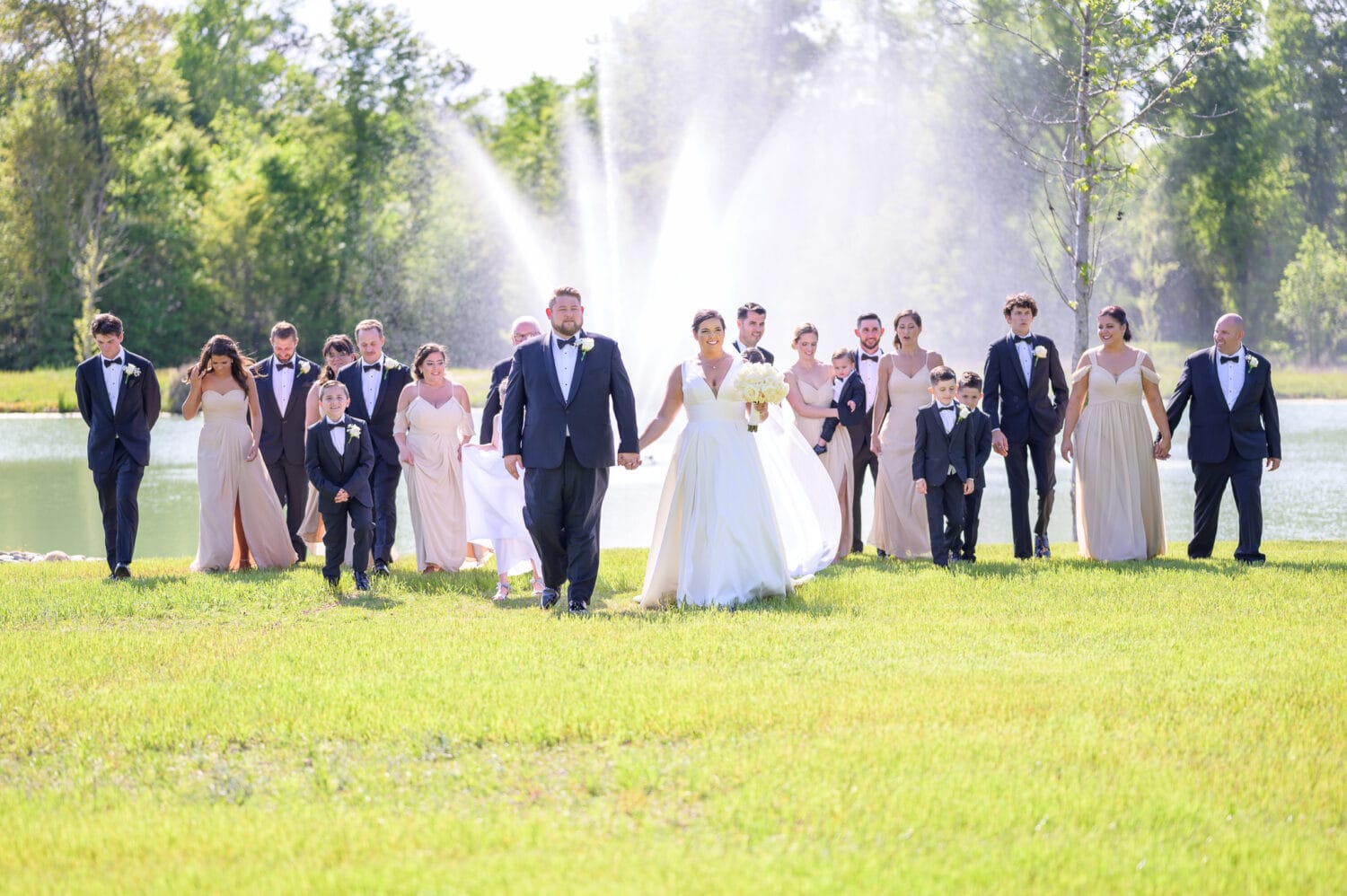 Bridal party walking from the lake - The Venue at White Oaks Farm