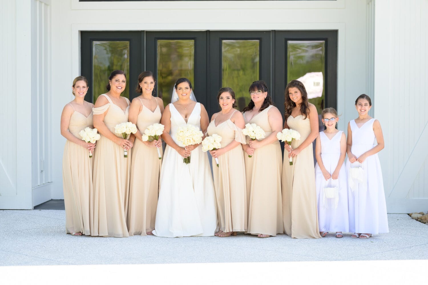 Bridesmaids in front of the entrance doors - The Venue at White Oaks Farm