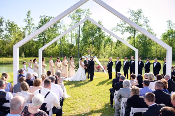 Ceremony under the arches  - The Venue at White Oaks Farm