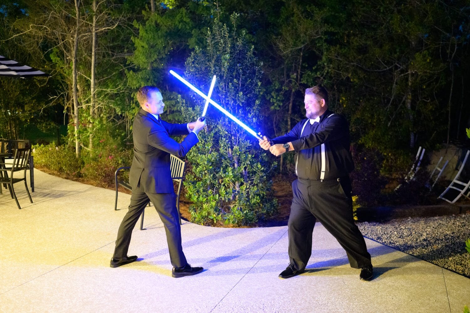 Groom and groomsmen having fun with lightsabers  - The Venue at White Oaks Farm