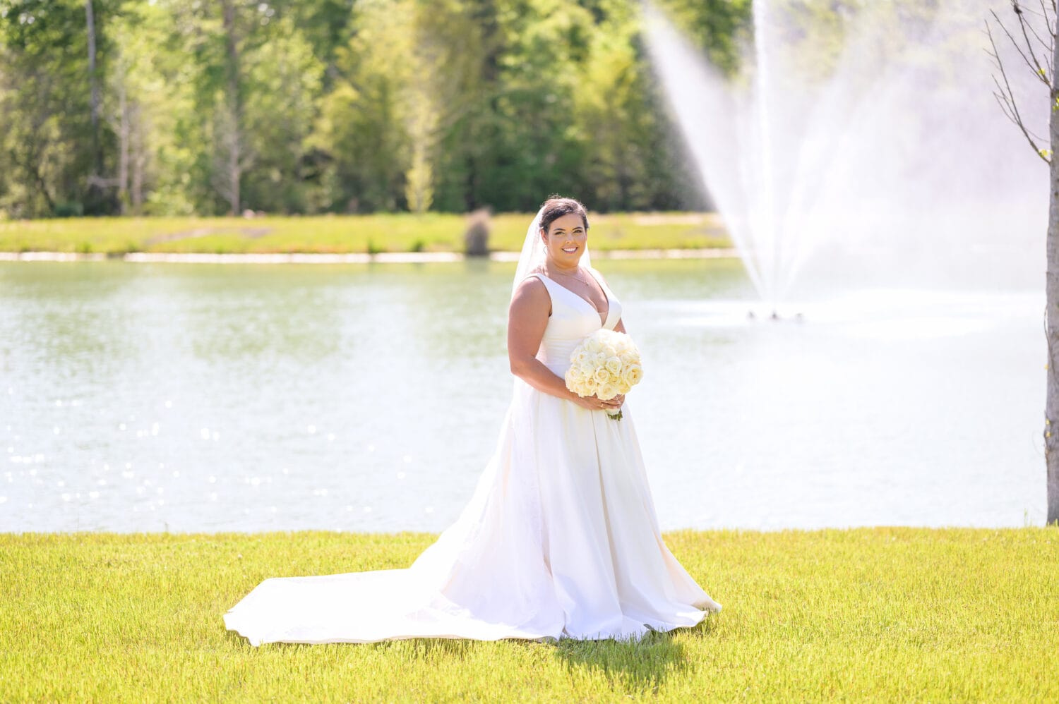 Portraits of the bride by the fountain - The Venue at White Oaks Farm