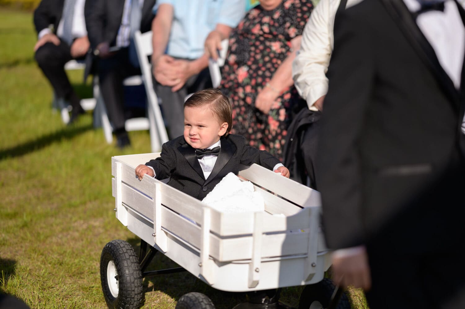 Ring-bearer riding in wagon - The Venue at White Oaks Farm