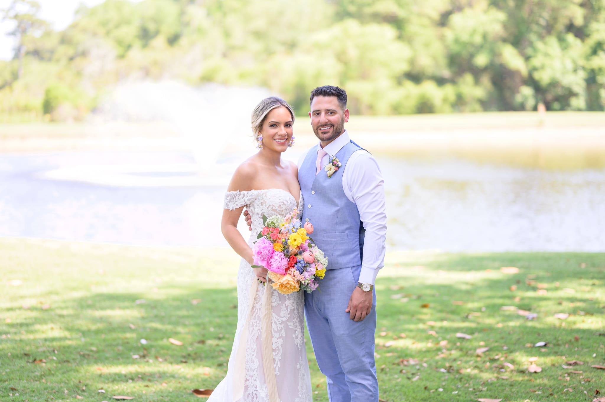 Bride and groom by the lake - Pawleys Plantation Golf & Country Club