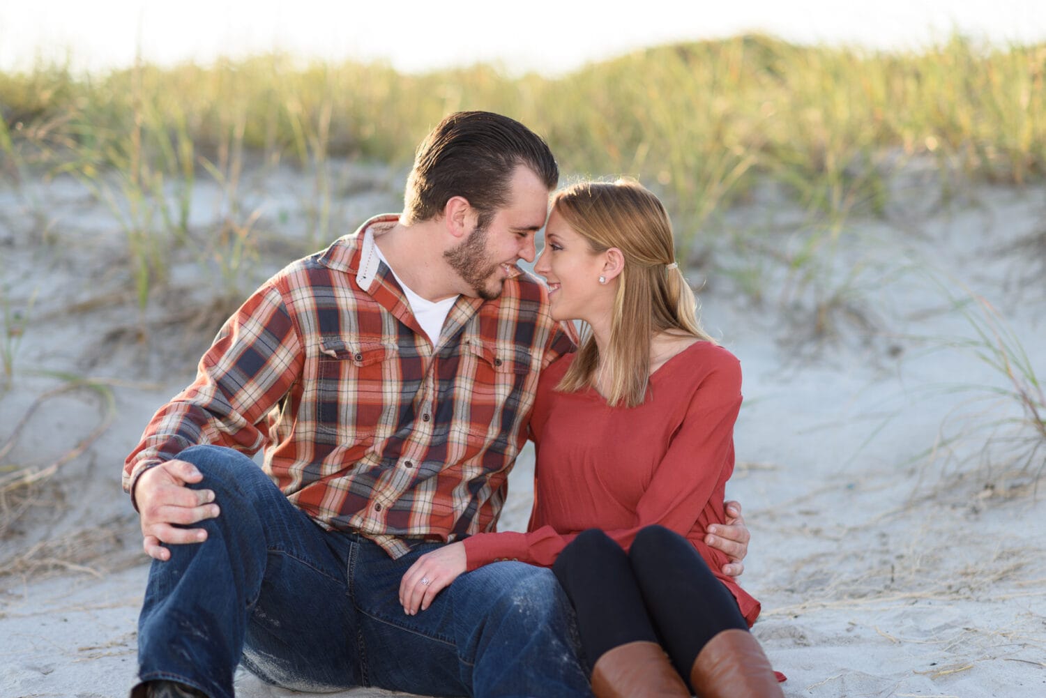 Cute couple with heads together in front of the dunes  - Myrtle Beach State Park