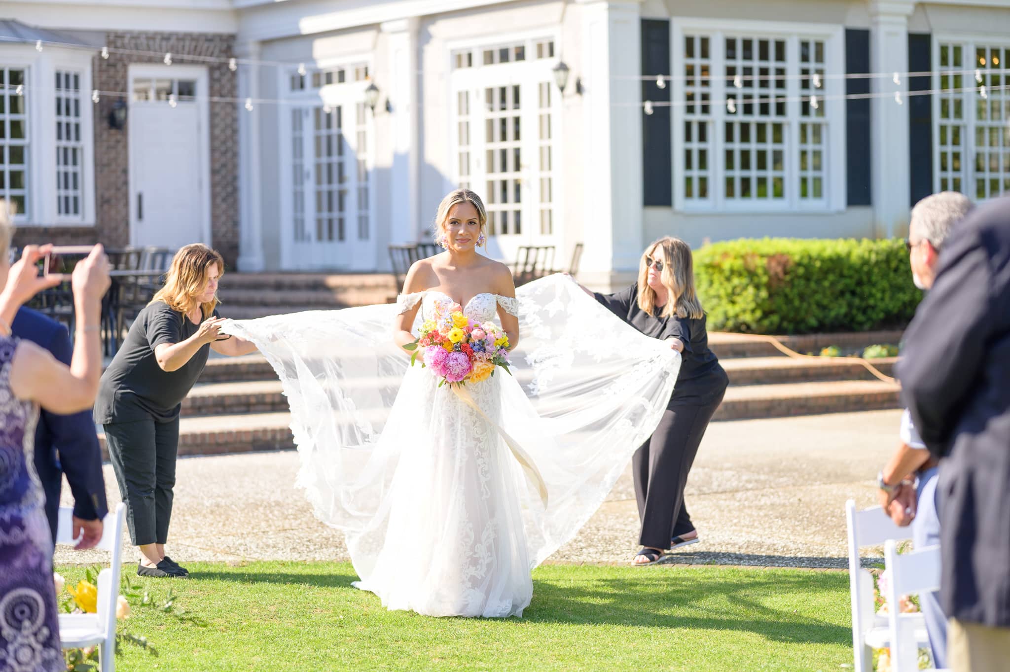 Fluffing the bride's dress - Pawleys Plantation Golf & Country Club