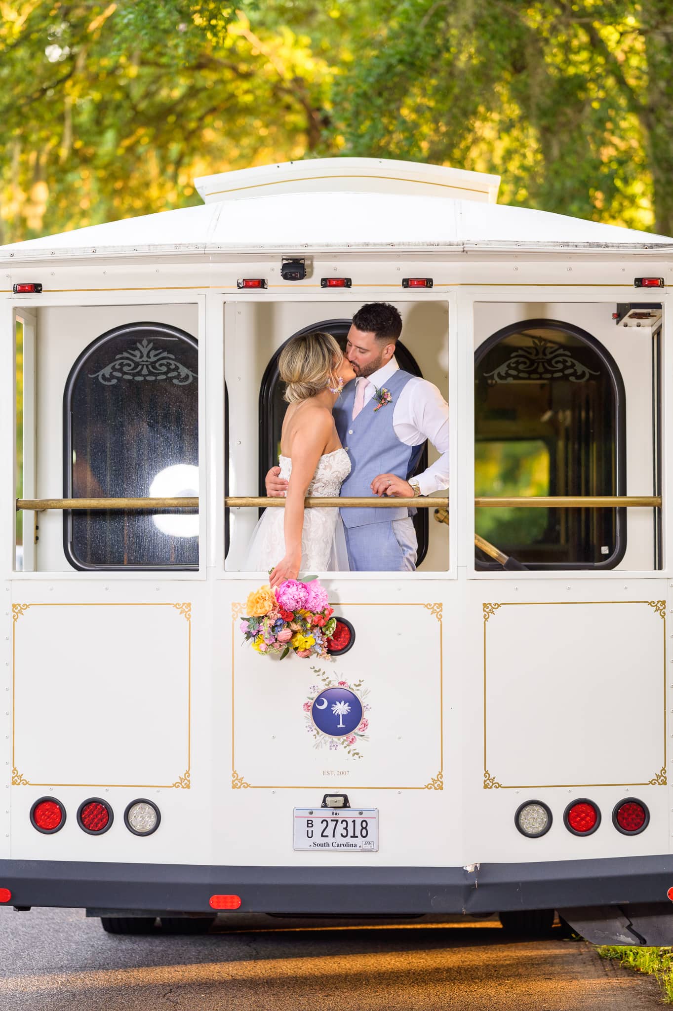 Portraits of the bride and groom with the white trolly - Pawleys Plantation Golf & Country Club