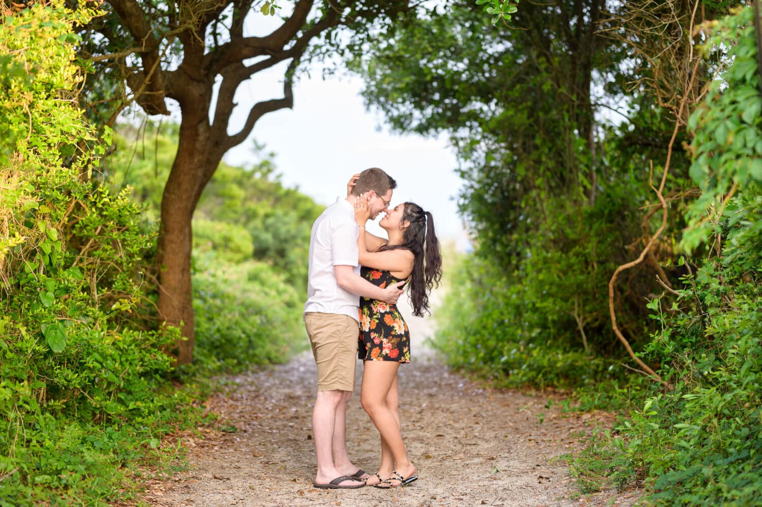 Pulling in for a kiss surrounded by the greenery on the beach walkway - Huntington Beach State Park - Myrtle Beach