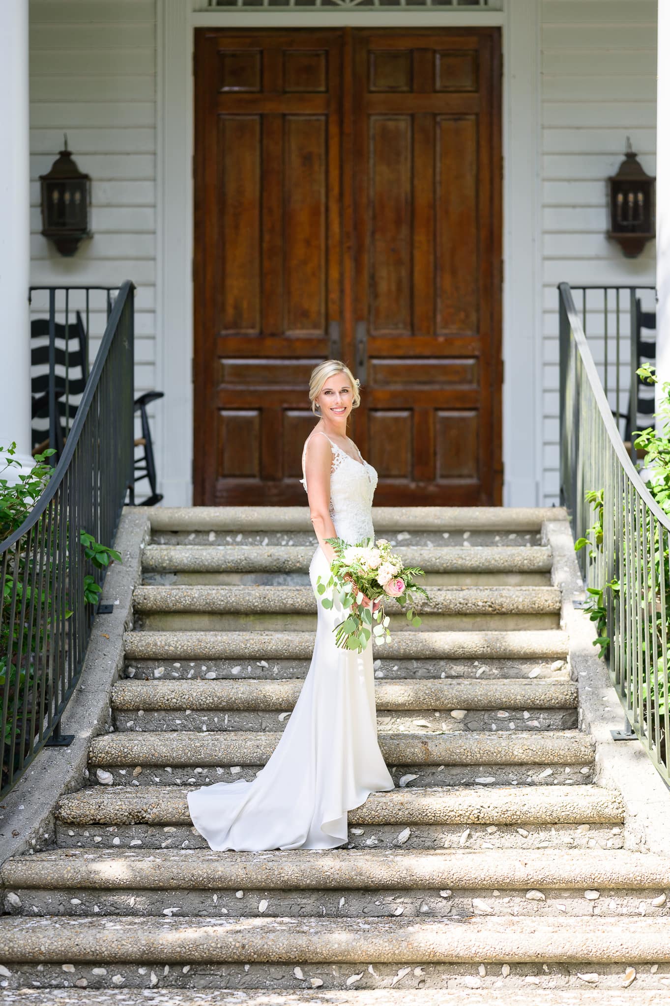 Bride on steps leading to clubhouse - Caledonia Golf & Fish Club