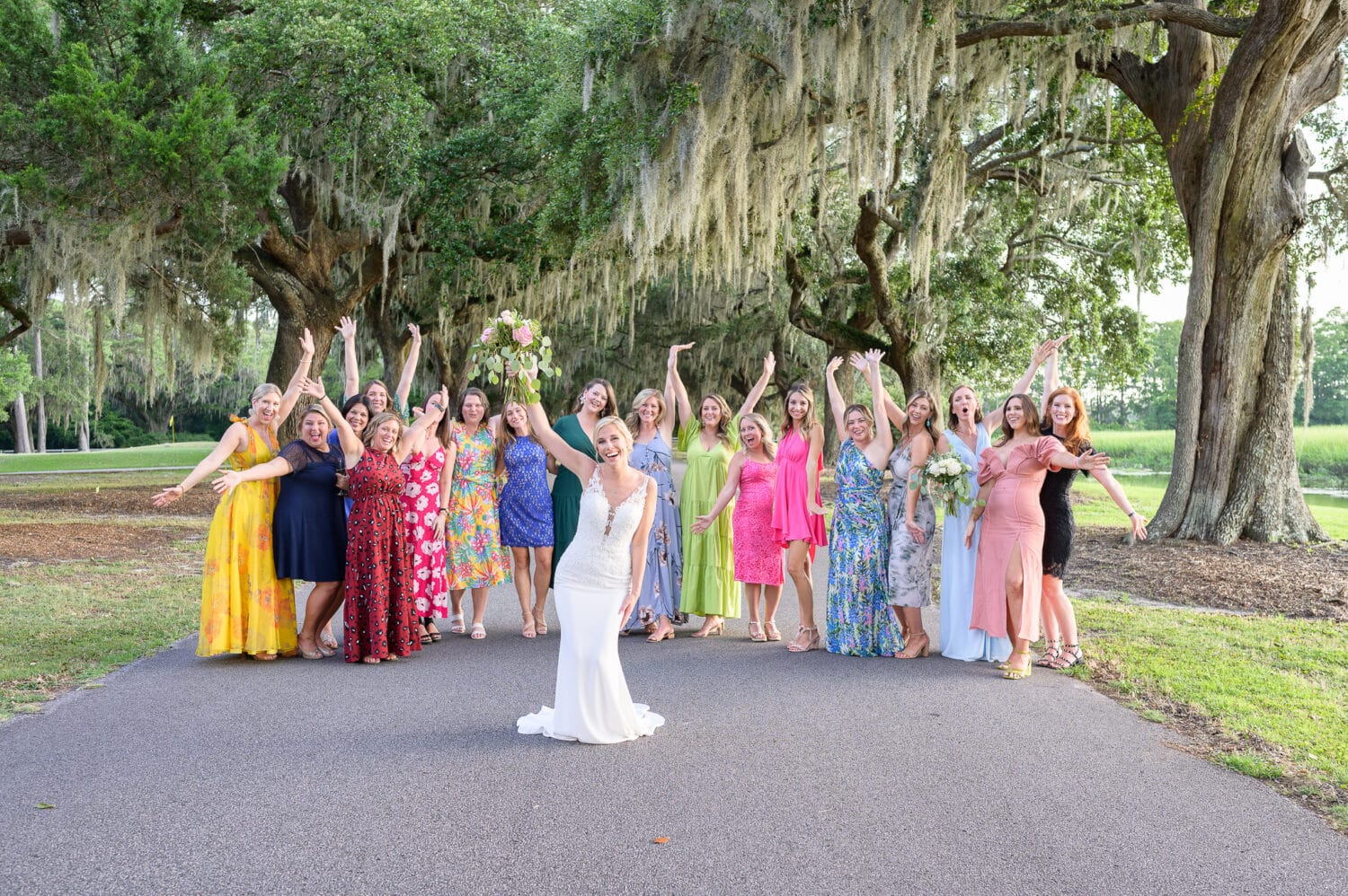 Bride with all her girlfriends cheering in the background - Caledonia Golf & Fish Club