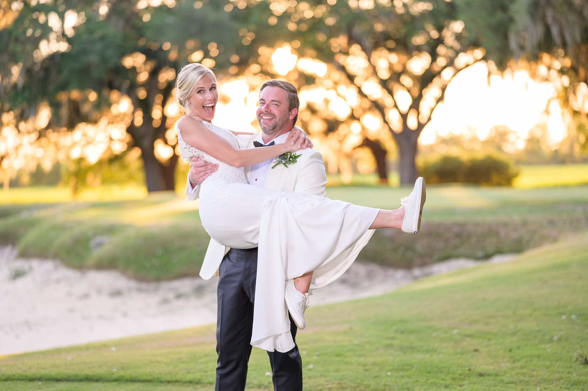 Lifting bride into the air - Caledonia Golf & Fish Club