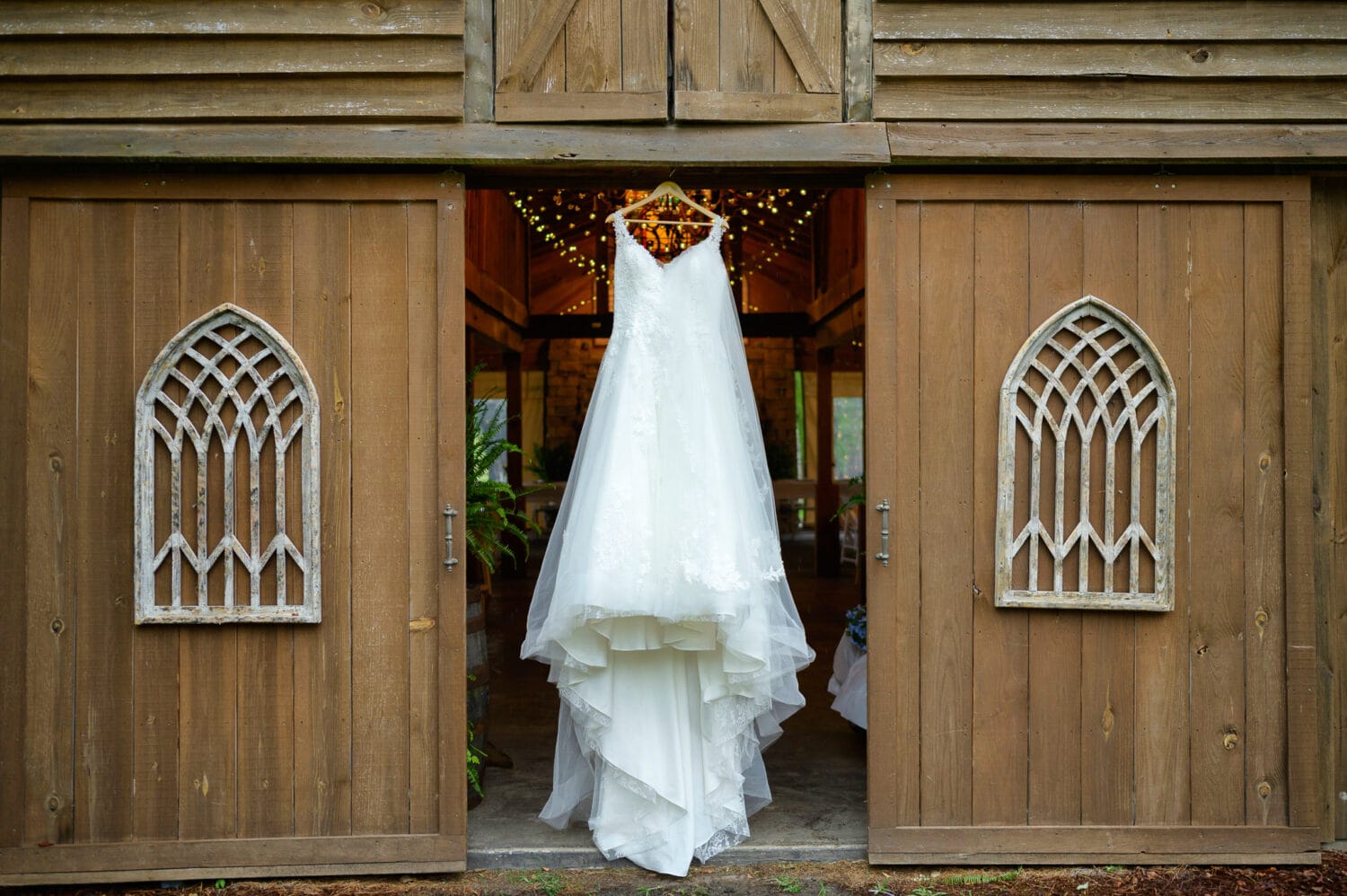 Wedding dress hanging in the barn - Wildhorse at Parker Farms