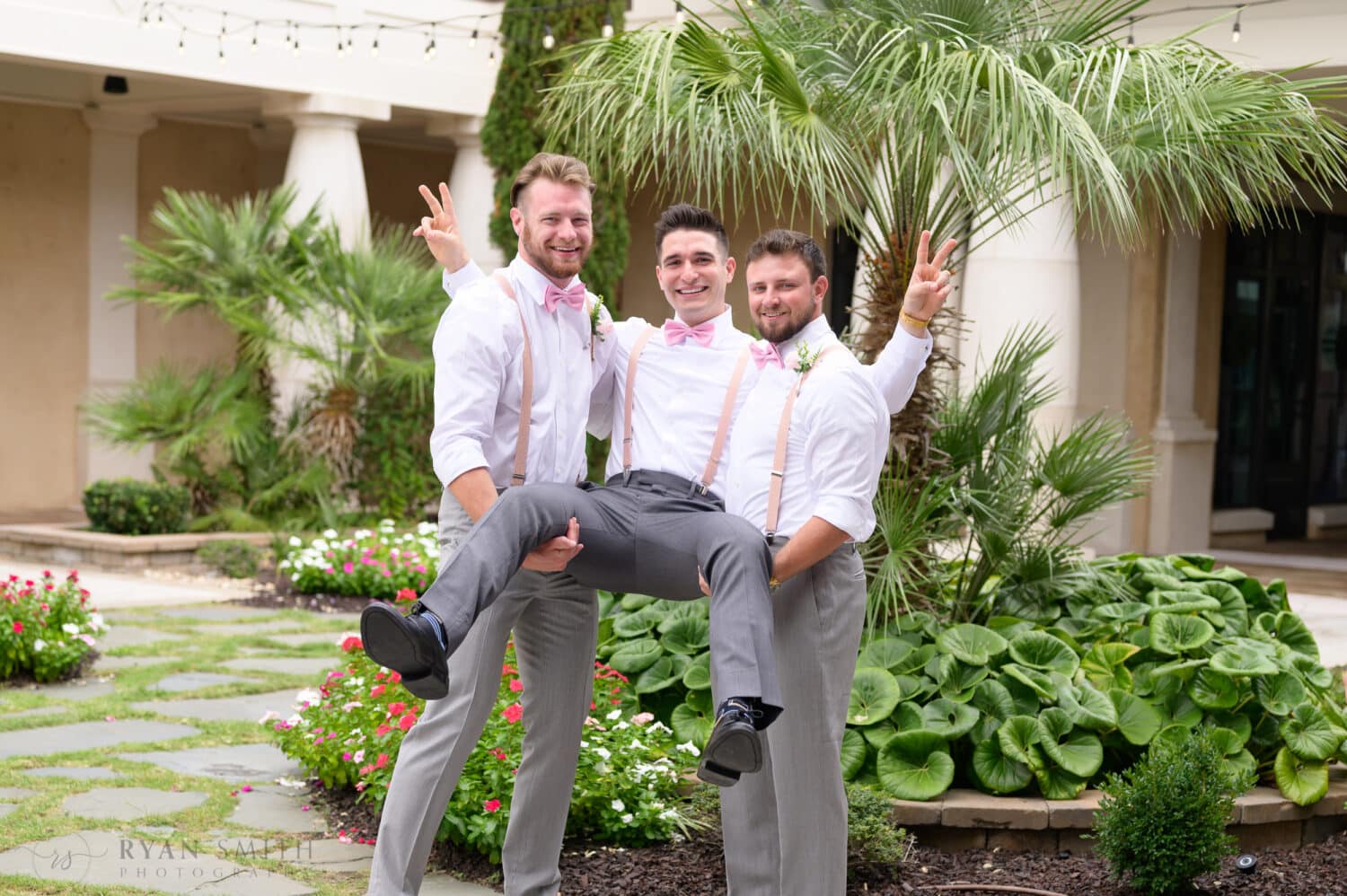 Brothers lifting up the groom - 21 Main Events at North Beach