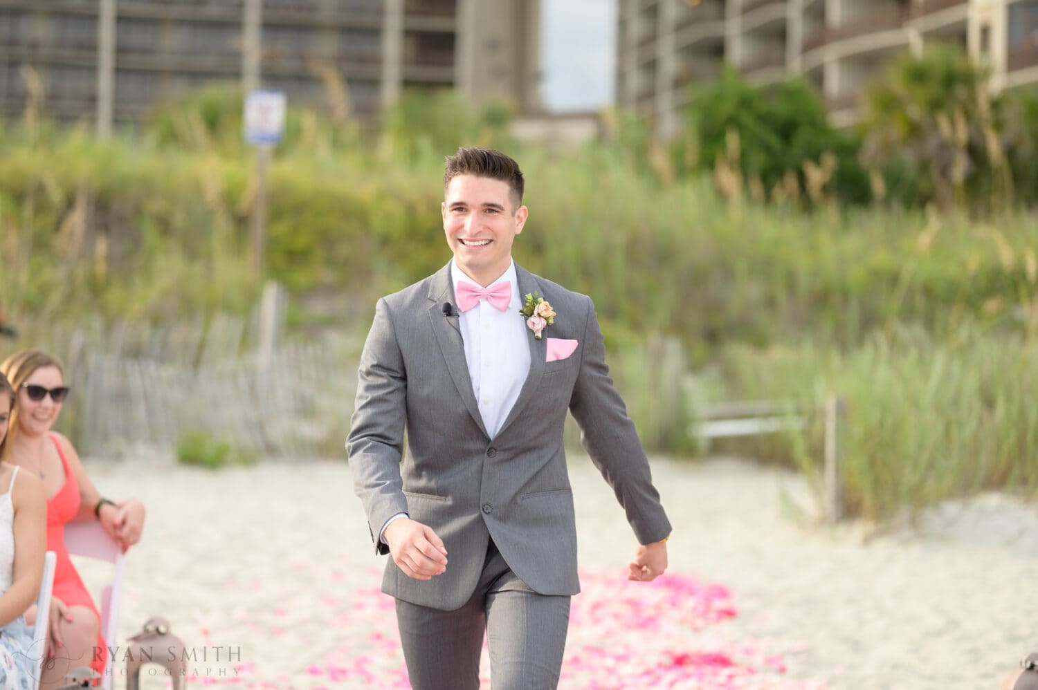 Happy groom walking to the ceremony - 21 Main Events at North Beach