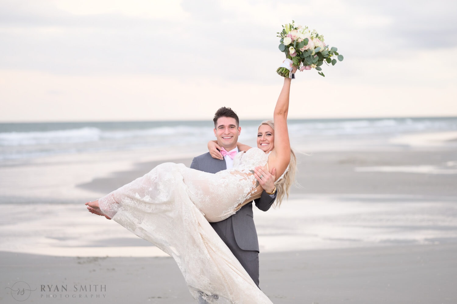 Lifting bride into the air - 21 Main Events at North Beach