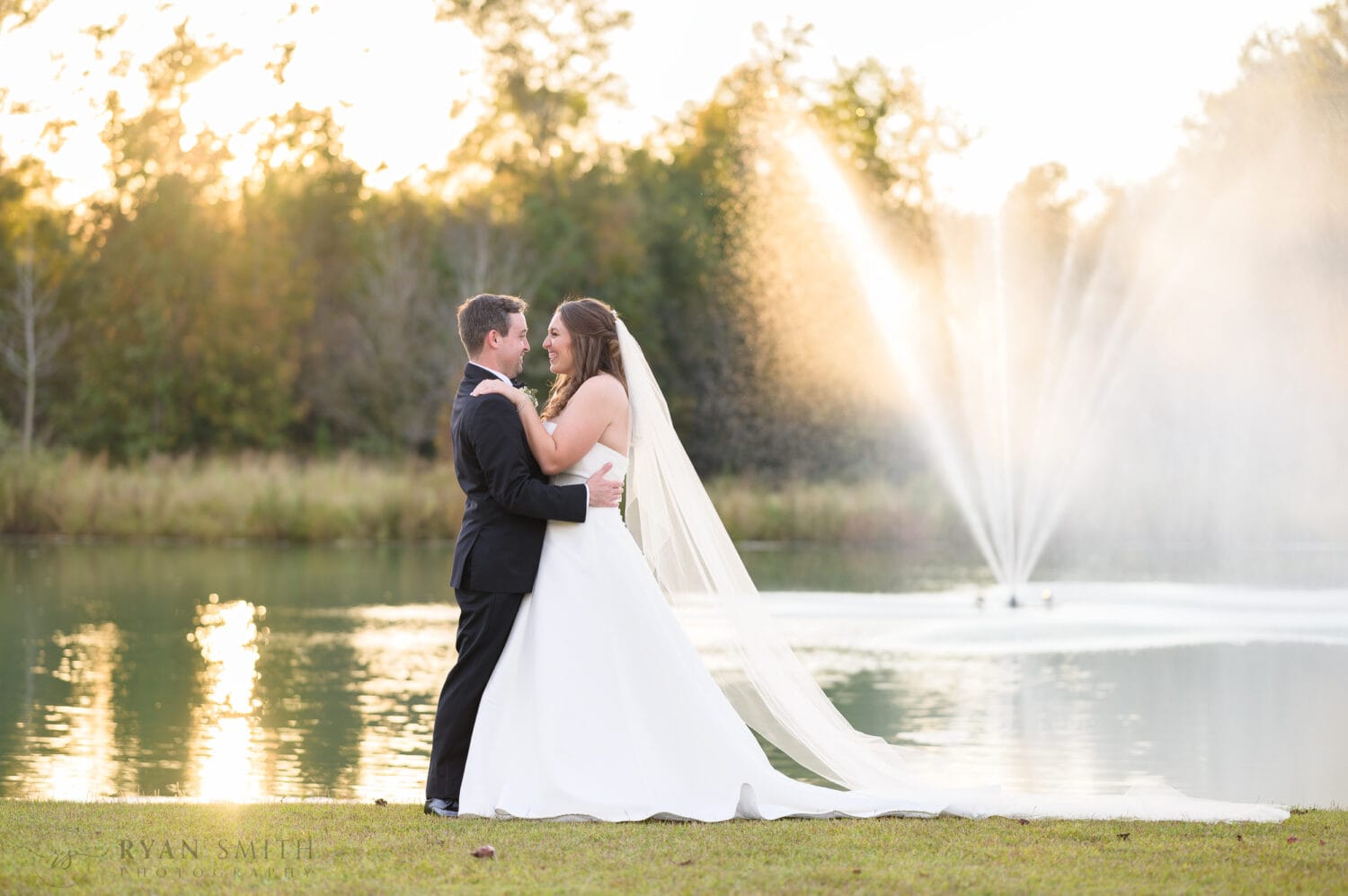 Big smiles with bride and groom in the sunset - The Venue at White Oaks Farm