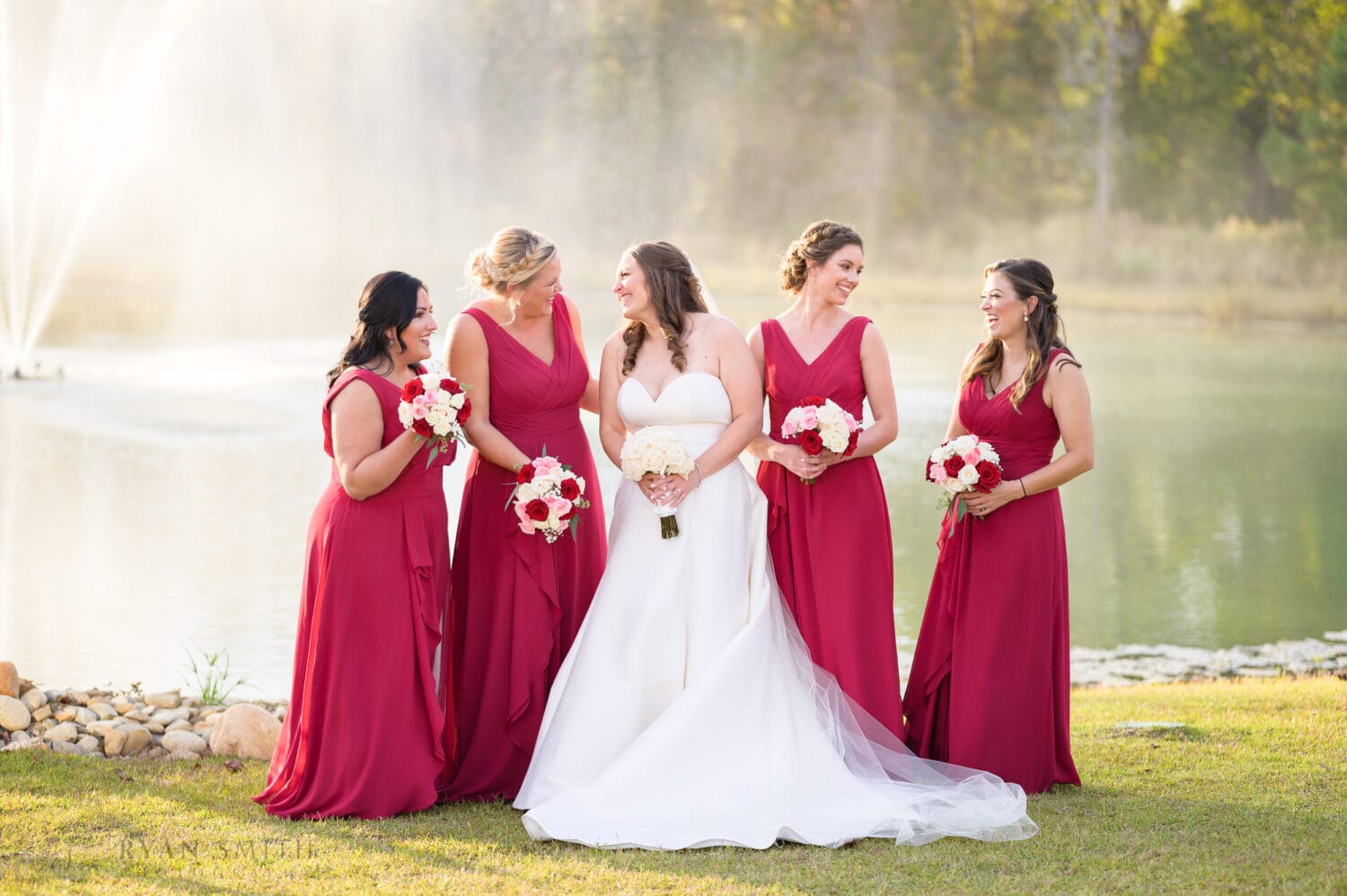 Bridesmaids laughing by the fountain - The Venue at White Oaks Farm