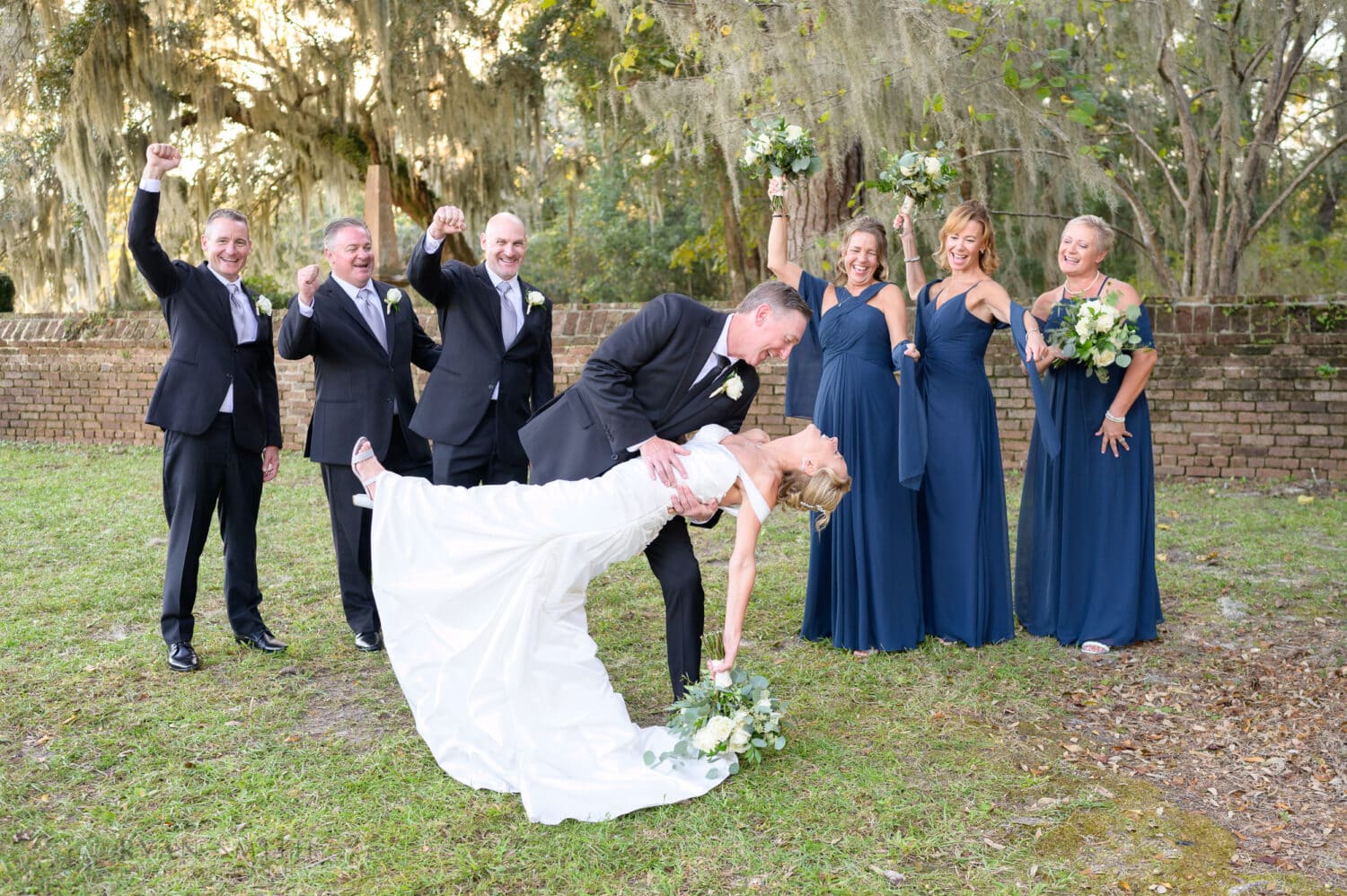 Dipping bride back in front of the bridal party - Safe Harbor Reserve Harbor Yacht Club