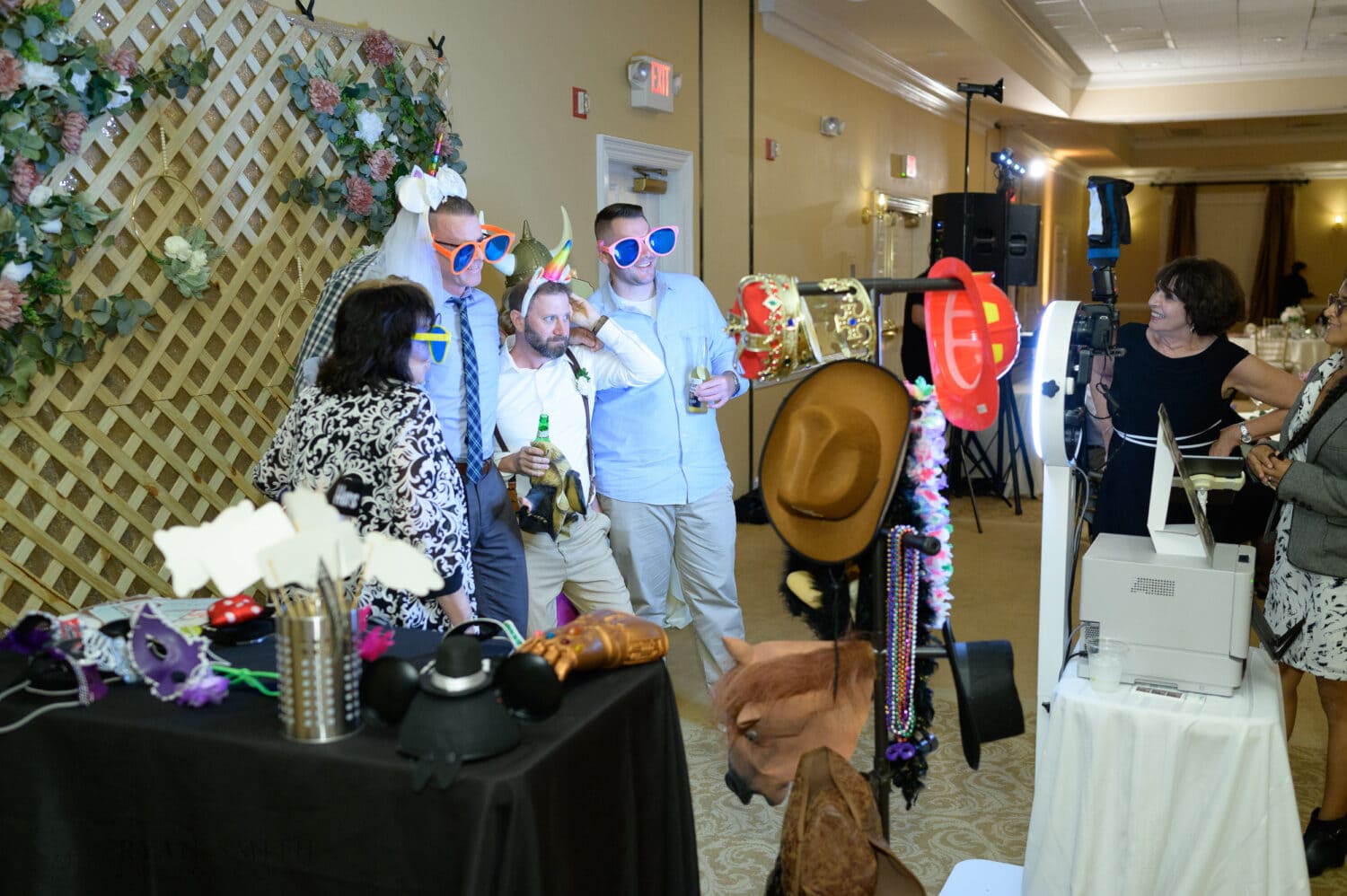 Fun photo booth pictures with a custom wooden lattice background - Pawleys Plantation Golf & Country Club