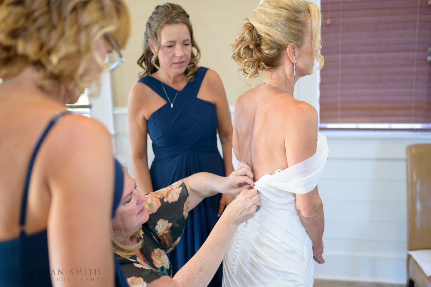 Helping bride with her dress - Safe Harbor Reserve Harbor Yacht Club
