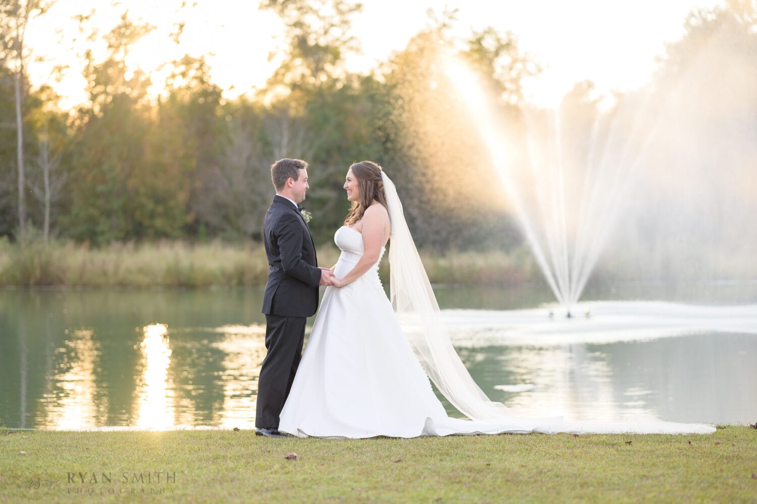 Holding hands in the sunset - The Venue at White Oaks Farm