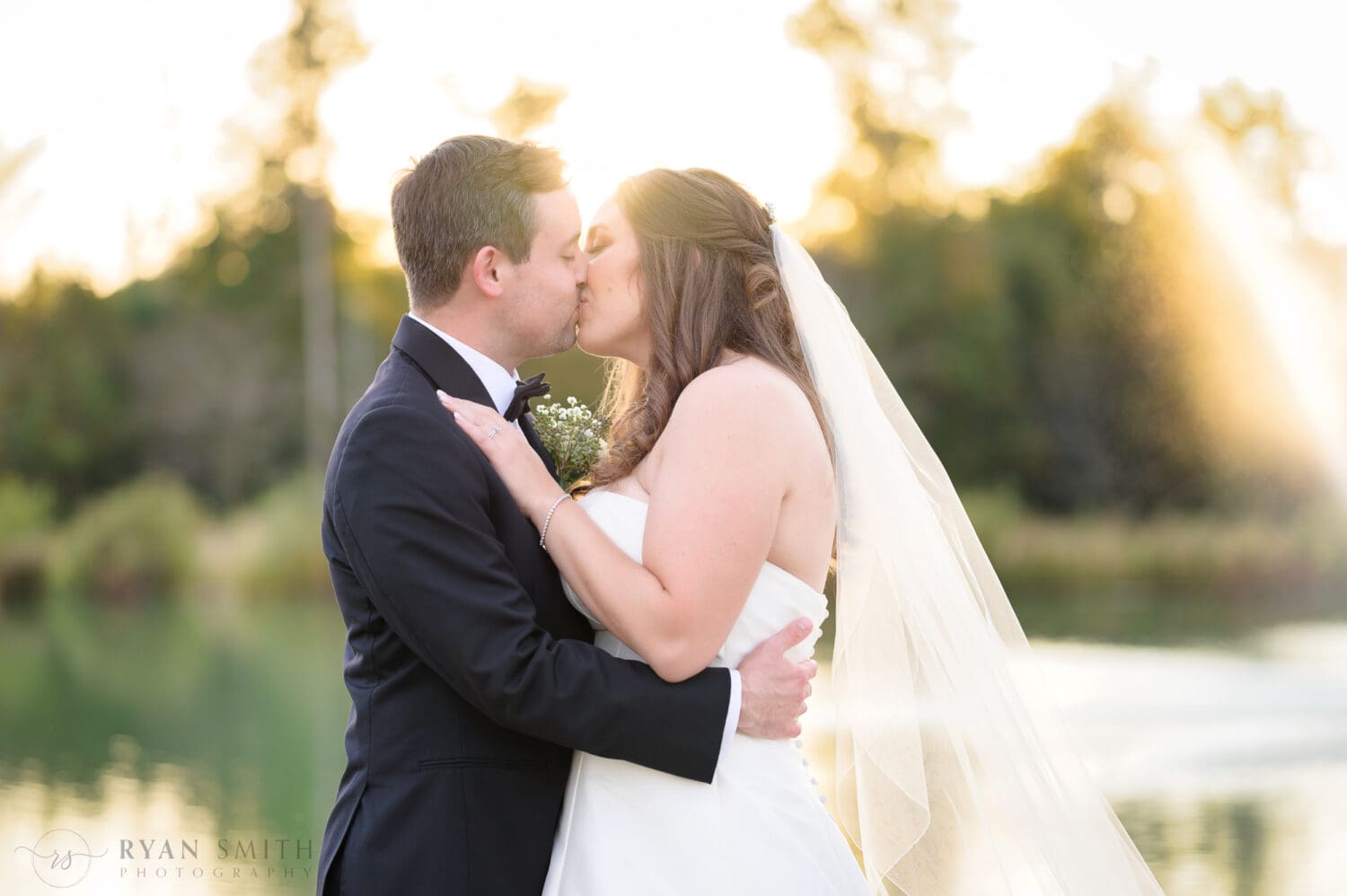 Kiss backlit by the sun - The Venue at White Oaks Farm