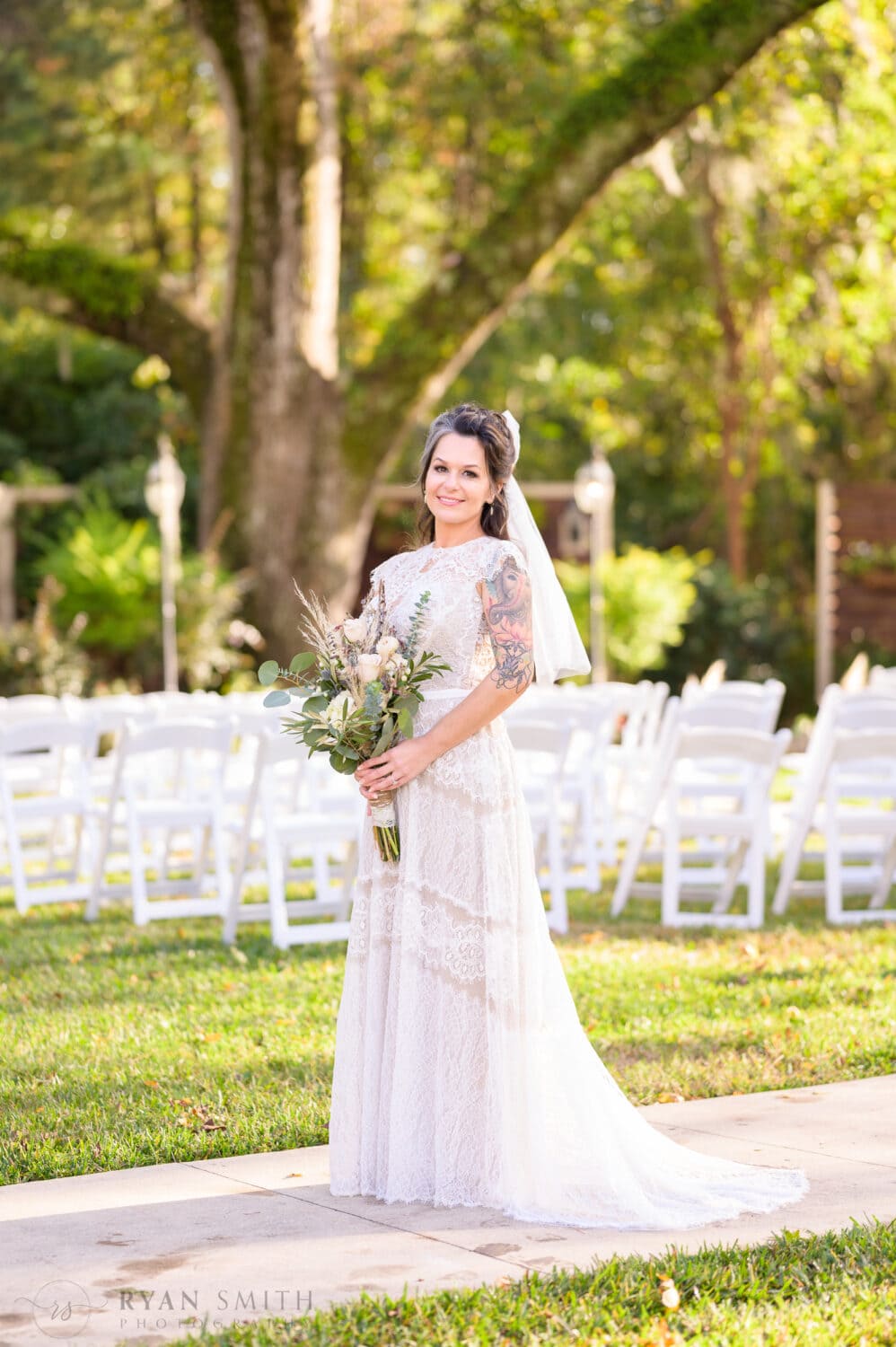 Bridal portraits in front of the ceremony area - The Cooper House