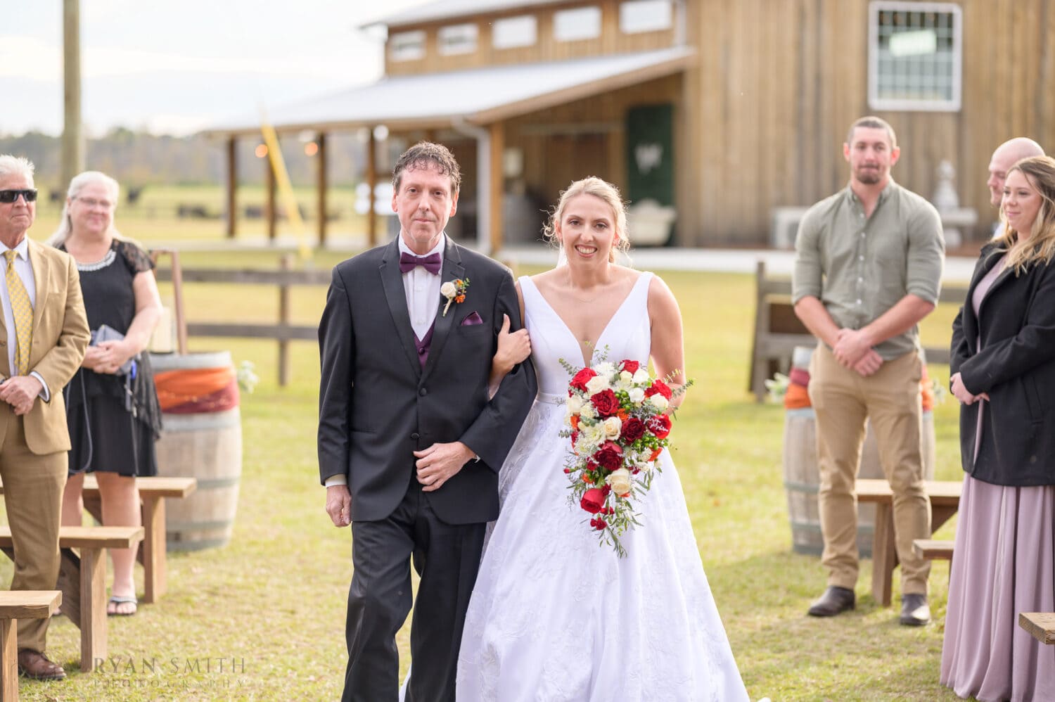 Bride and father walking down the aisle  - The Blessed Barn