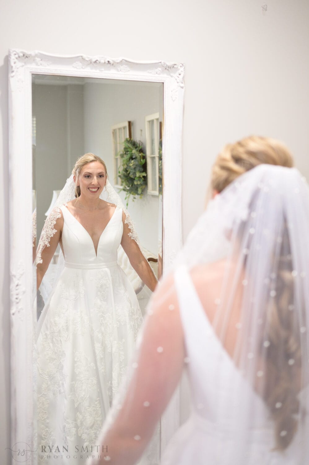 Bride looking in the mirror - The Blessed Barn