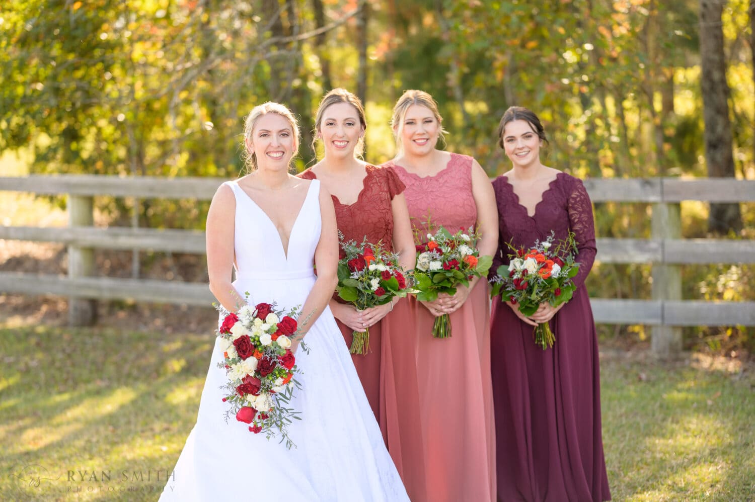 Bridesmaids standing behind the bride - The Blessed Barn