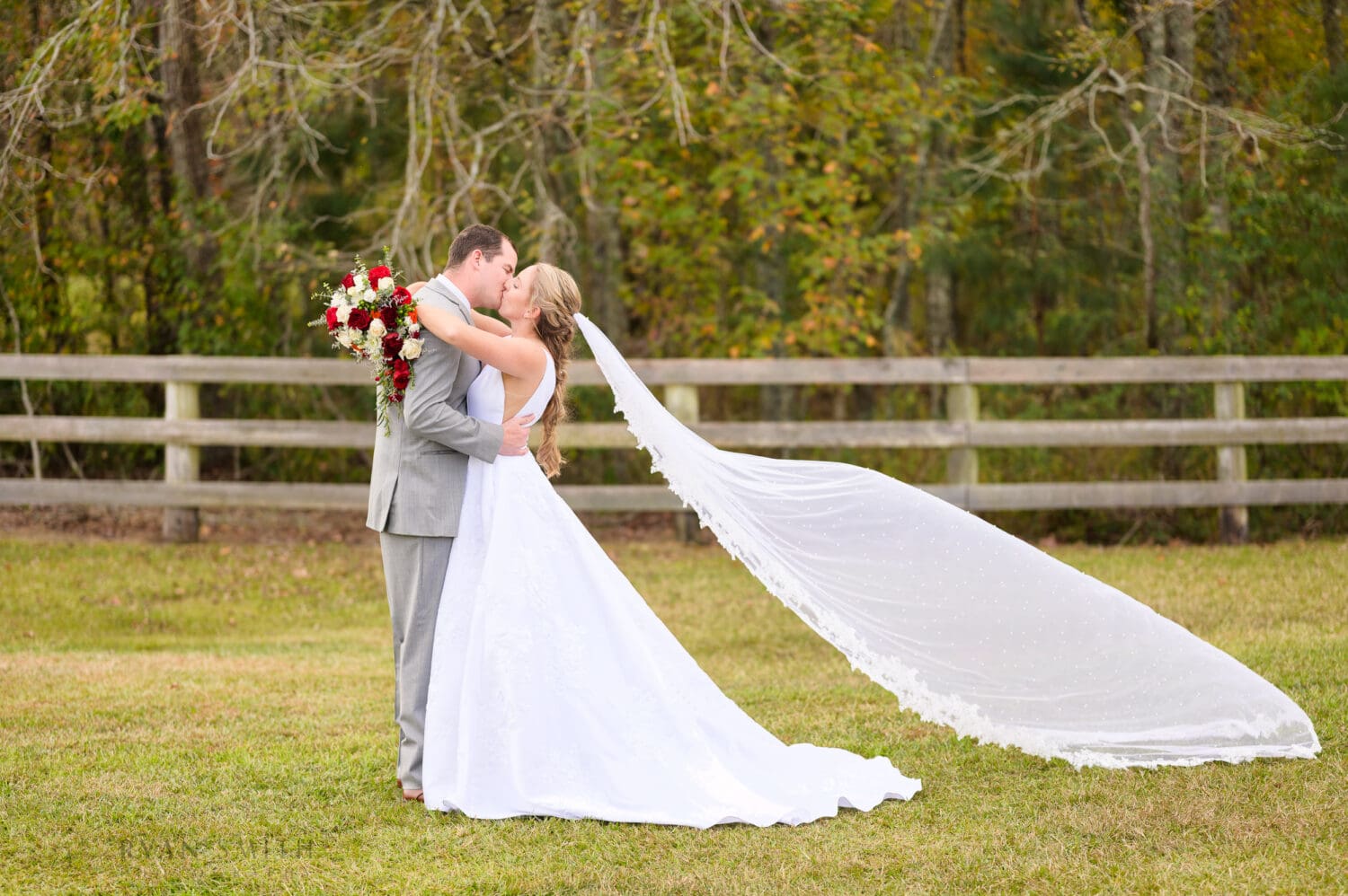 Fluffing the veil into the air for pictures - The Blessed Barn