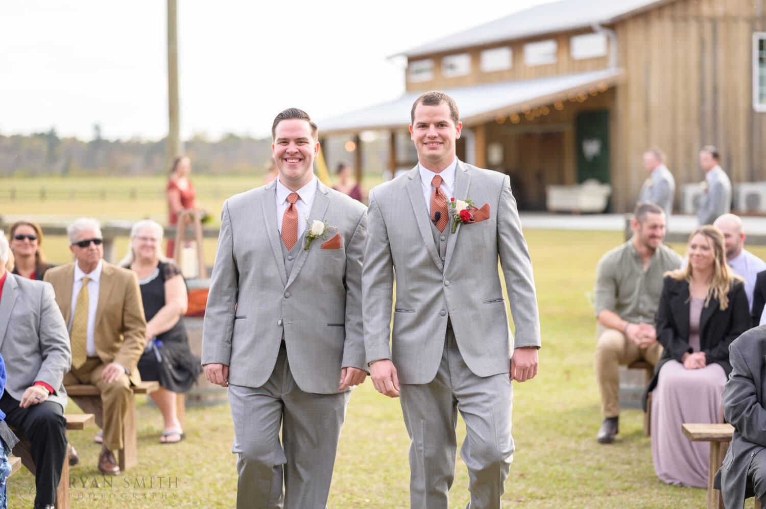 Groom and brother walking together - The Blessed Barn