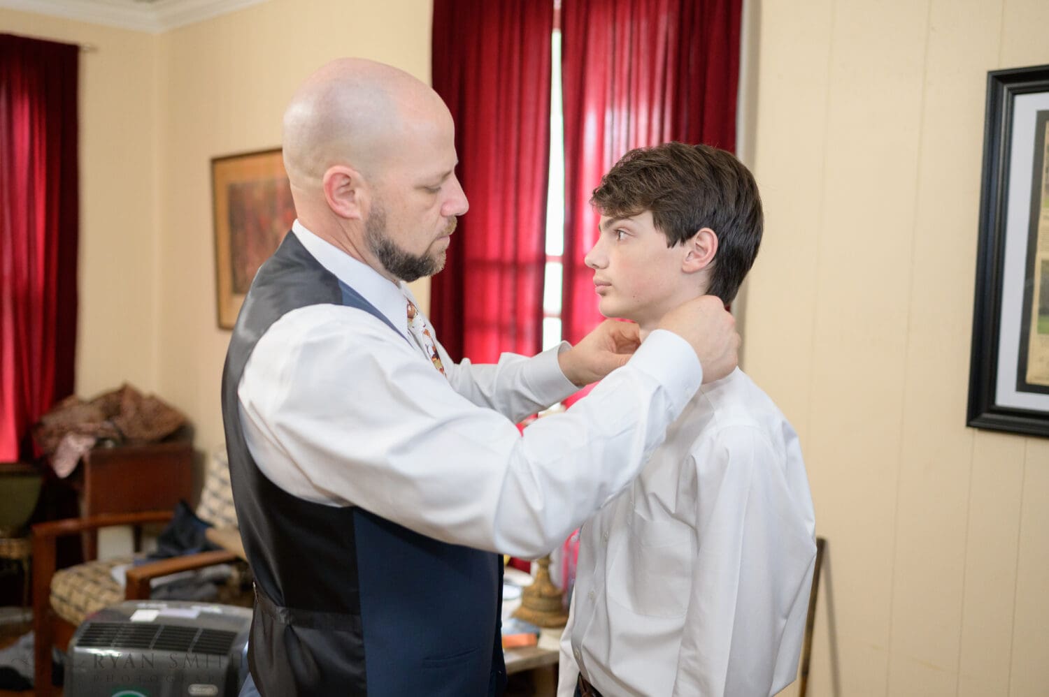 Groom helping sons with their ties - The Cooper House