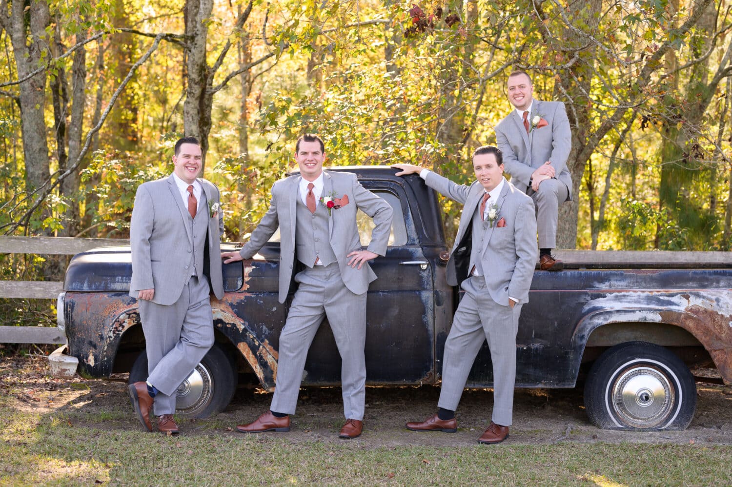 Guys posing silly by the old truck - The Blessed Barn
