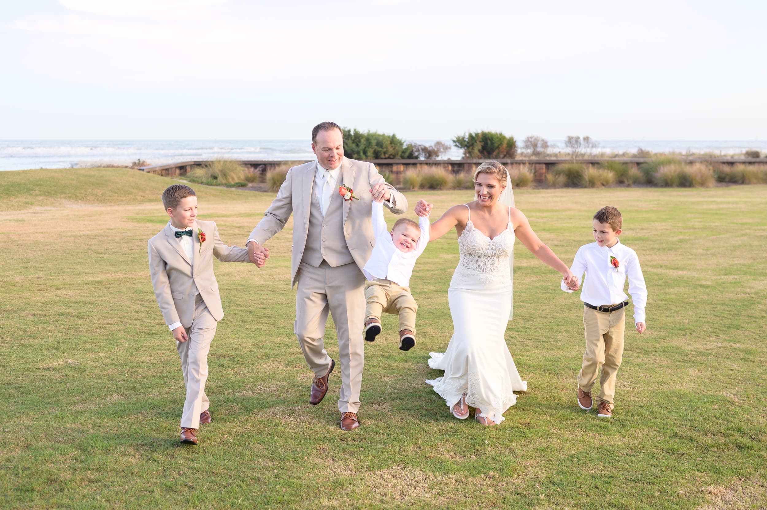 Happy new family of 5 having fun together after the wedding ceremony - Dunes Golf & Beach Club