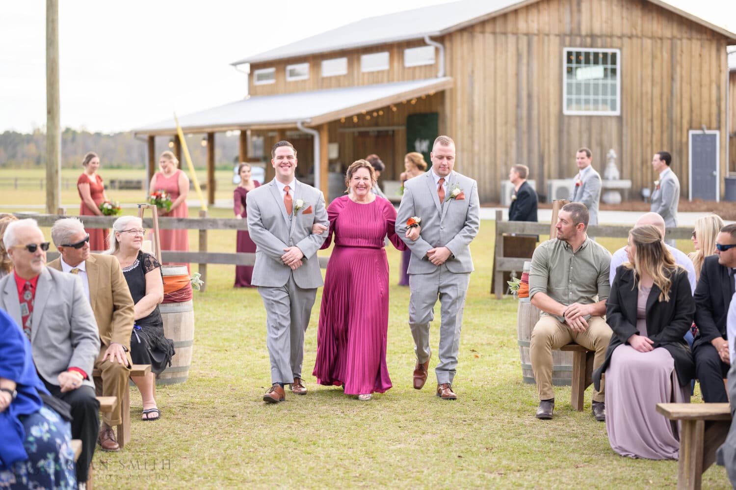 Mom walking with sons to the ceremony - The Blessed Barn