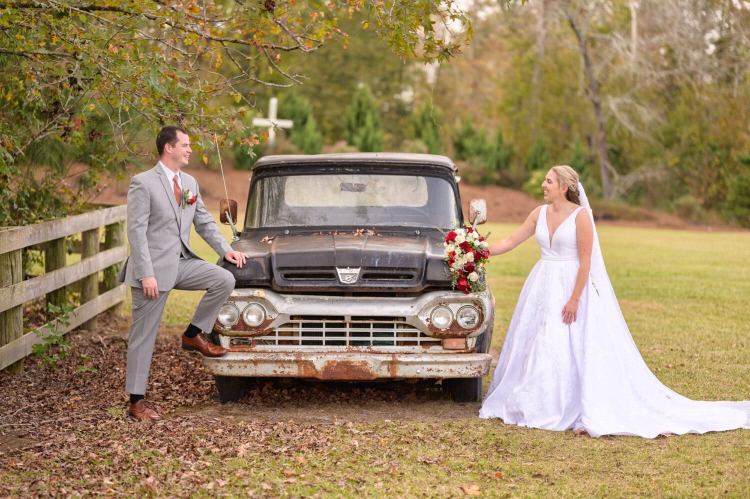 Portraits of the bride and groom around the vintage truck - The Blessed Barn