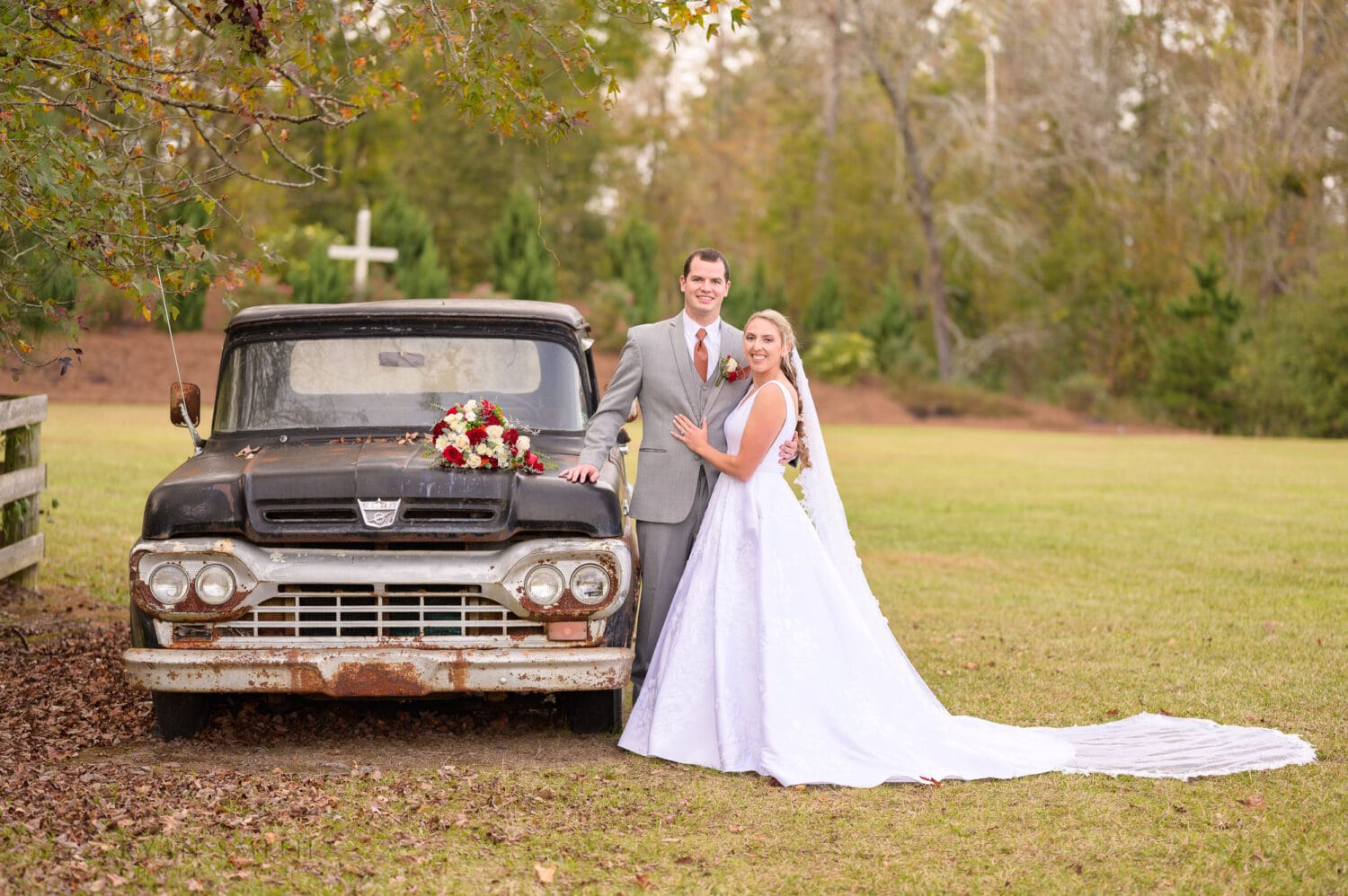 Portraits of the bride and groom around the vintage truck - The Blessed Barn