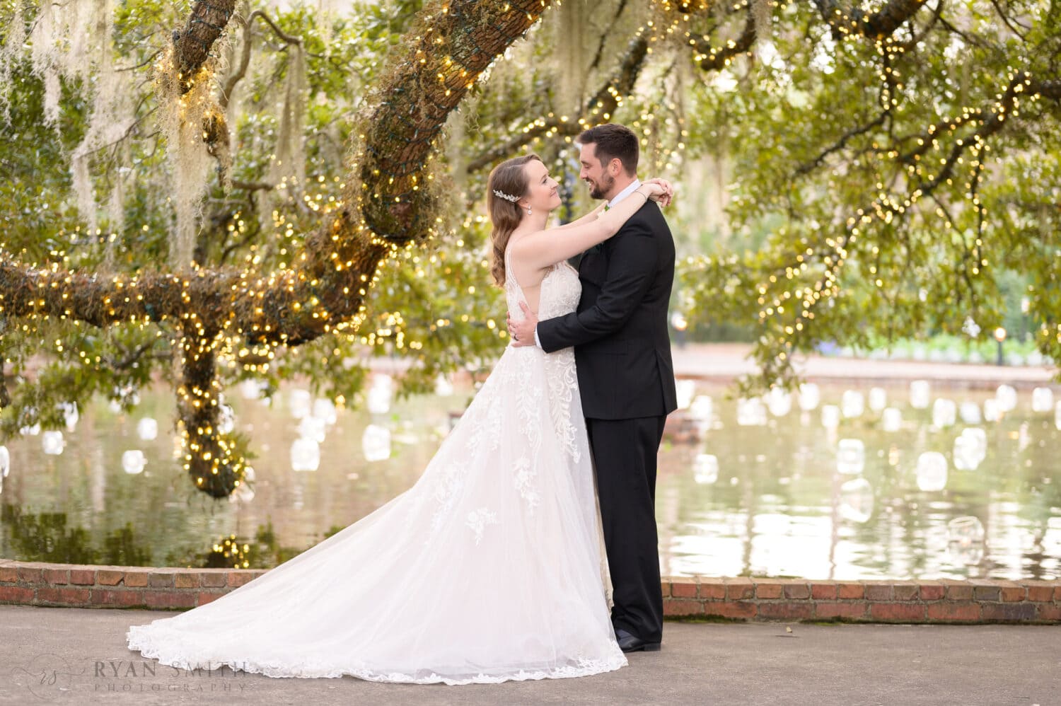 Bride and groom looking in each others eyes - Diana of the Chase Fountain - Brookgreen Gardens