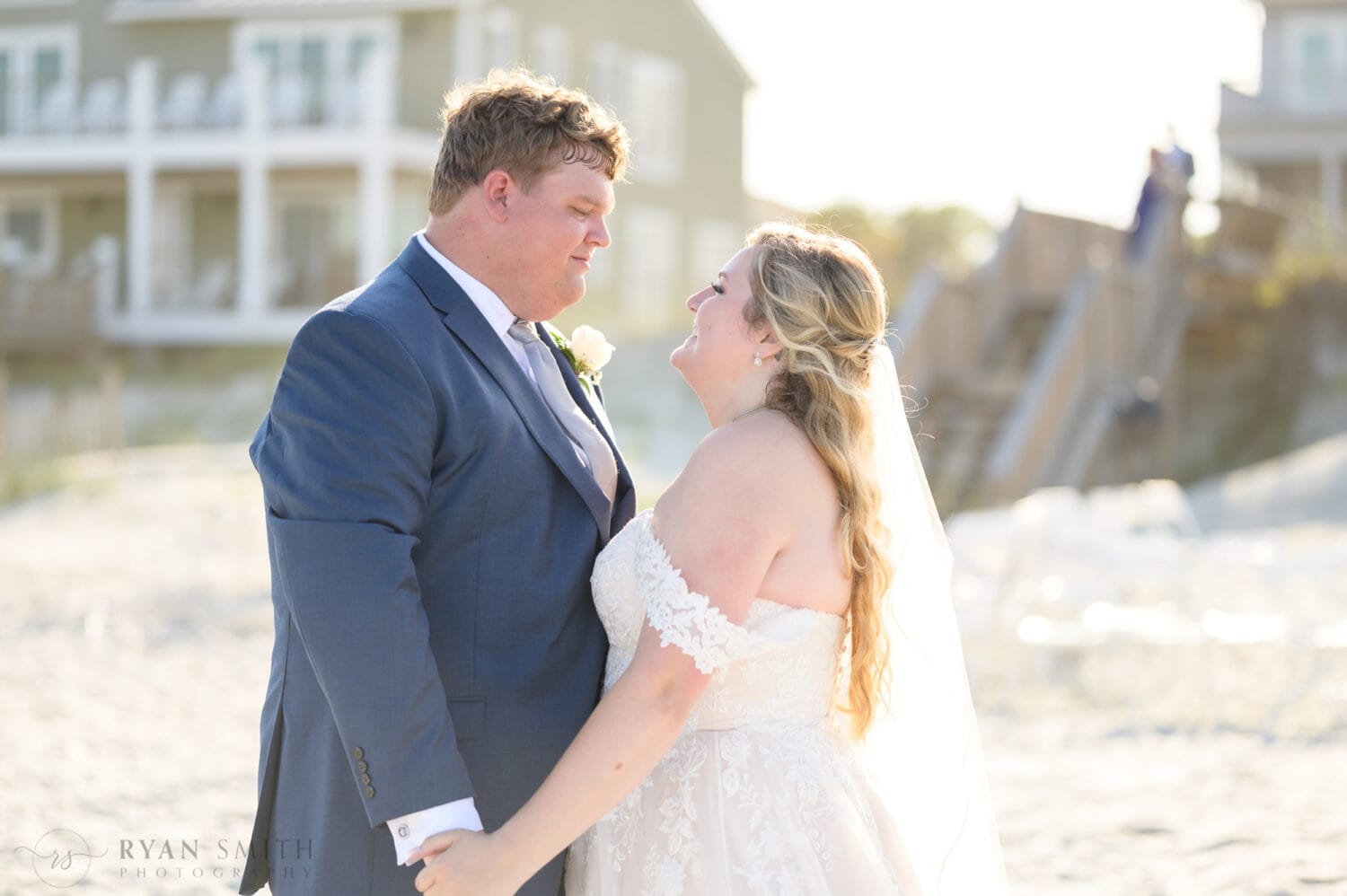 Bride and groom on the beach in the bright sun - Pawleys Island Beach House
