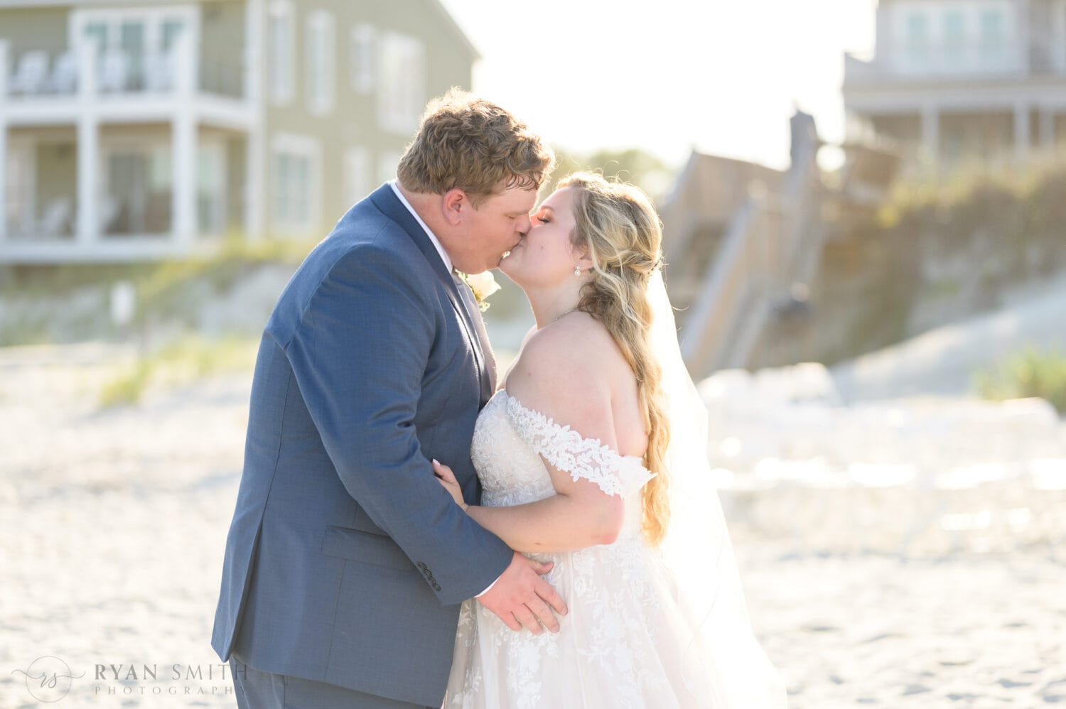 Bride and groom on the beach in the bright sun - Pawleys Island Beach House
