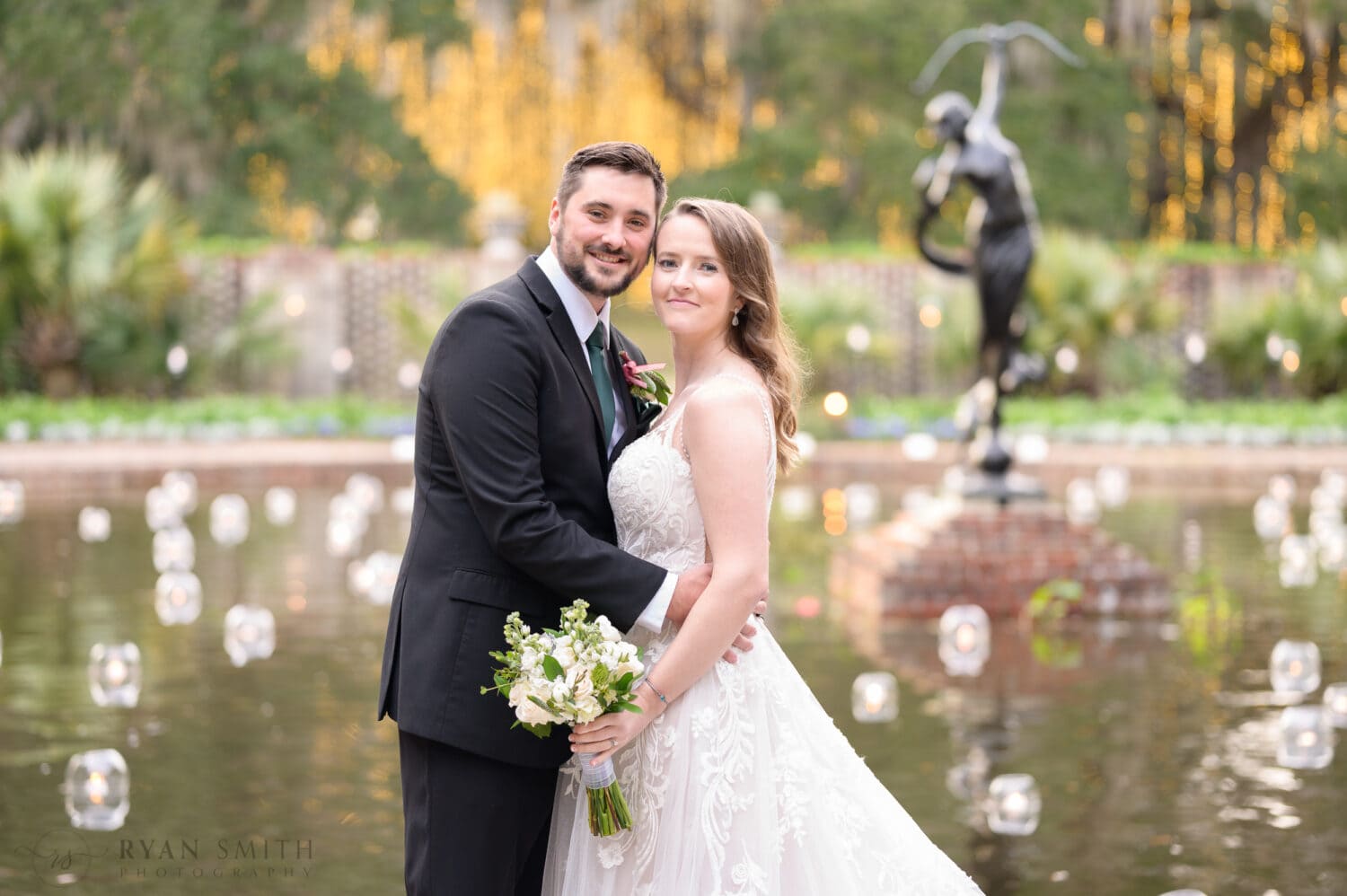 Bride and groom with the candles on the water - Diana of the Chase Fountain - Brookgreen Gardens