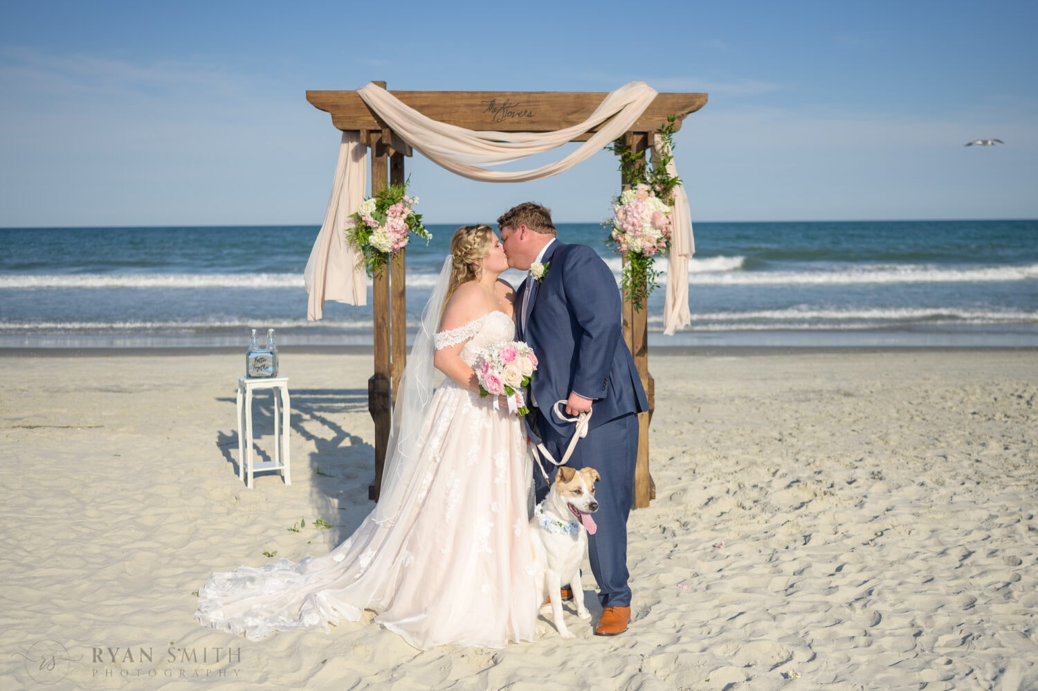 Bride and groom with the puppy - Pawleys Island Beach House