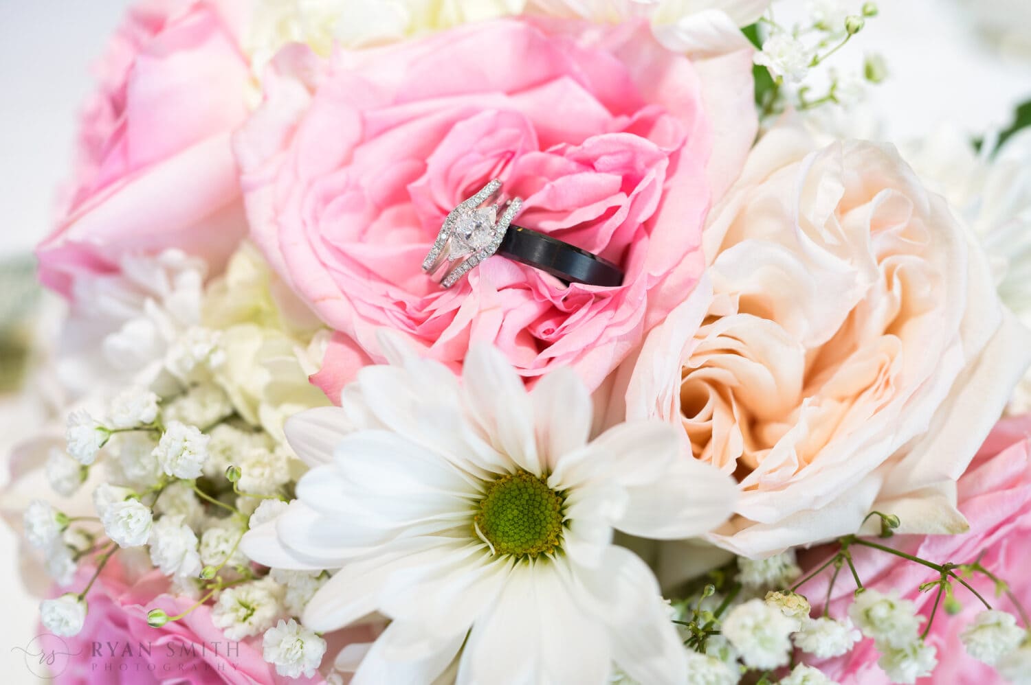 Bride and groom's rings on the flowers - Pawleys Plantation