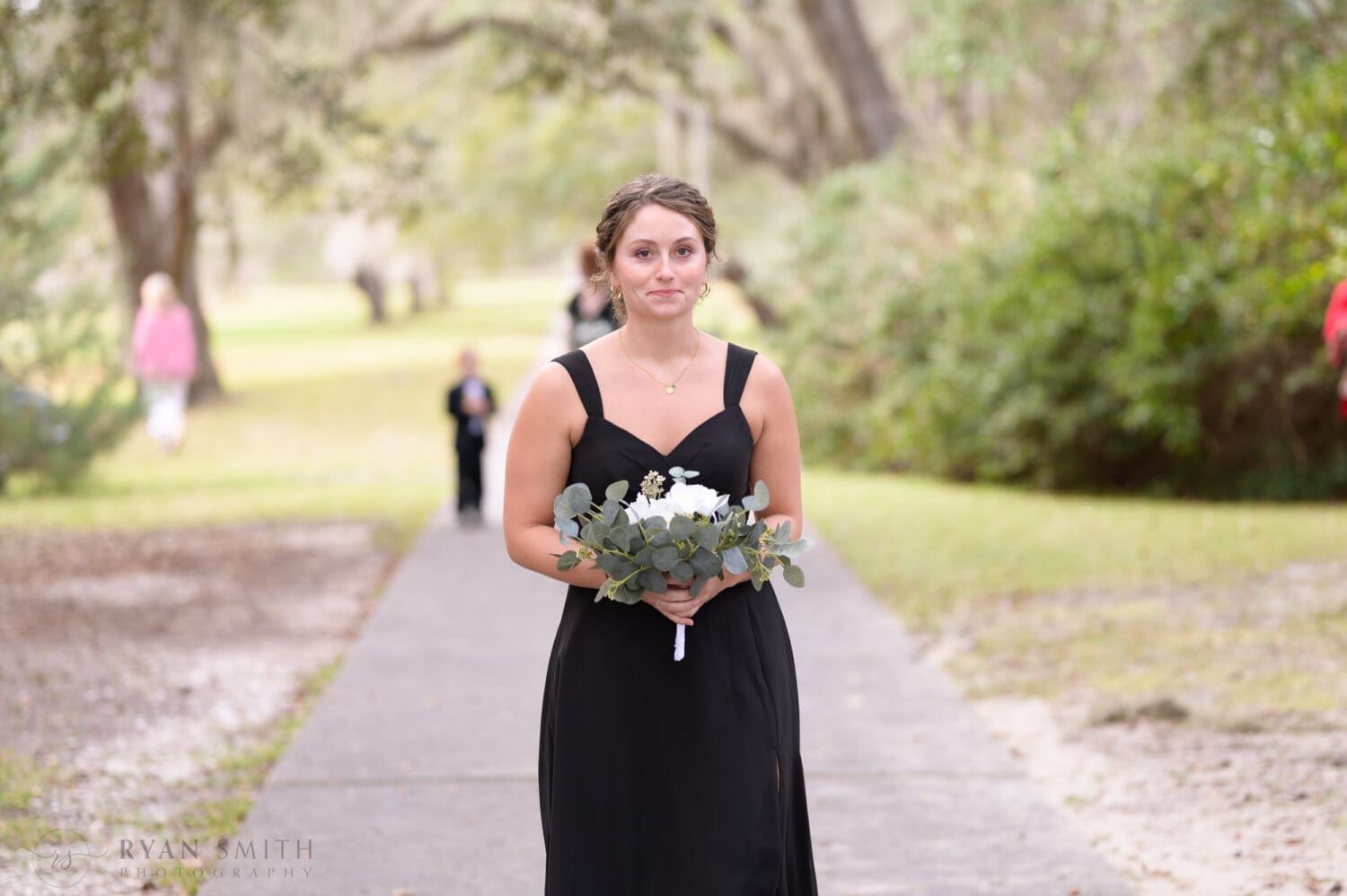 Bridesmaids walking to the ceremony - Brookgreen Gardens
