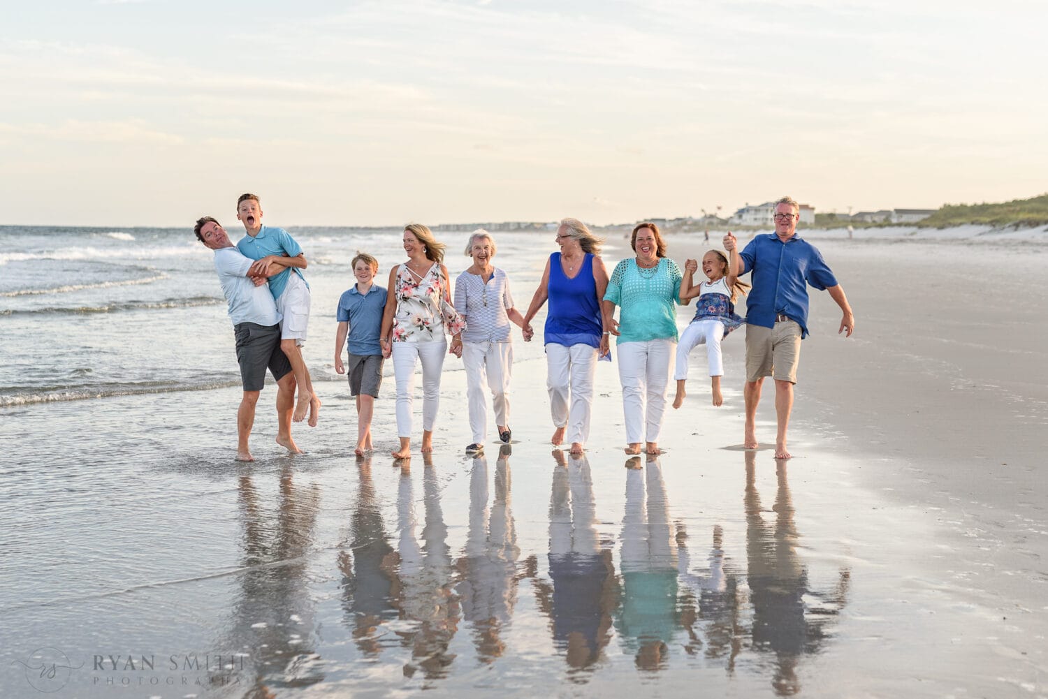 Family having fun walking down the beach - Huntington Beach State Park