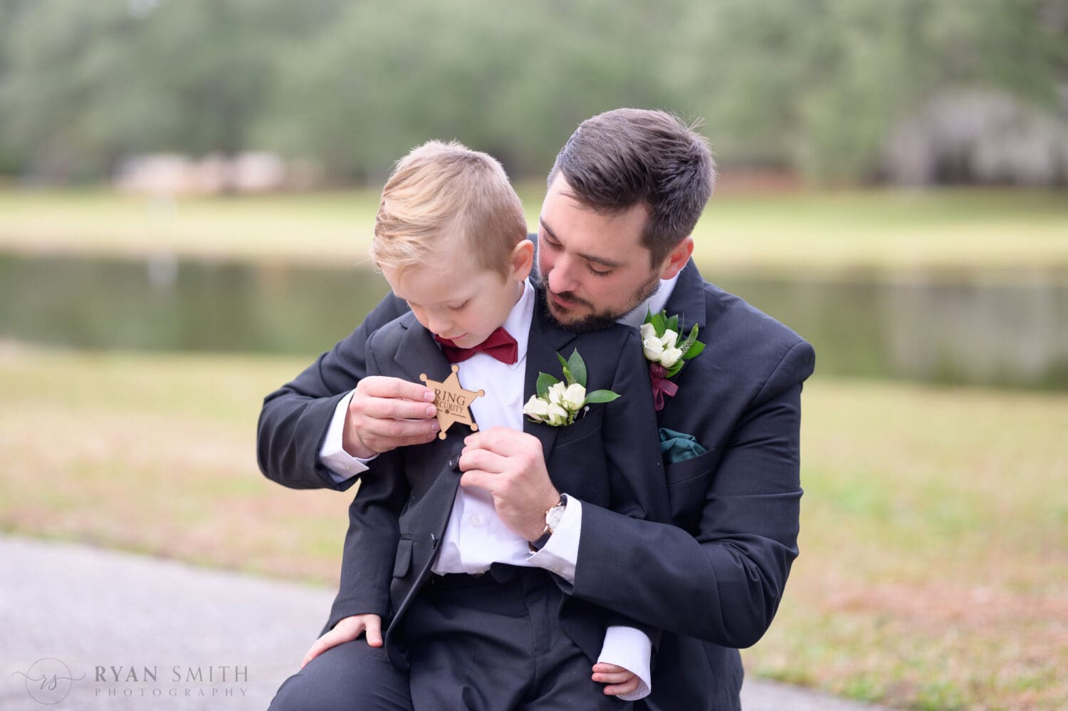 Groom putting on the Ring Security badge - Brookgreen Gardens